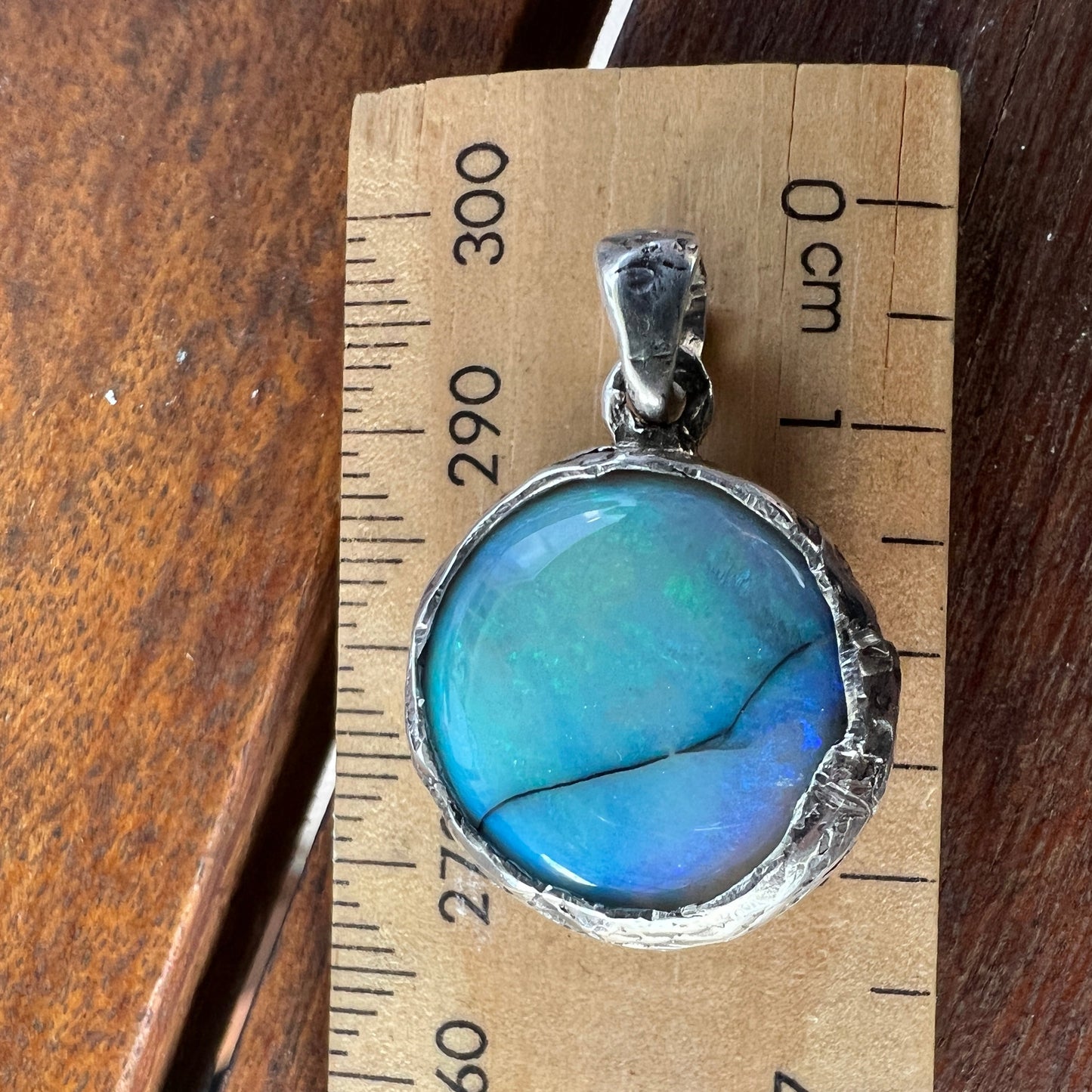 Awesome Lightning Ridge picture stone opal. Mounted with Argentium silver which shows off the stone perfectly. A beautiful design by Sally Fisher.