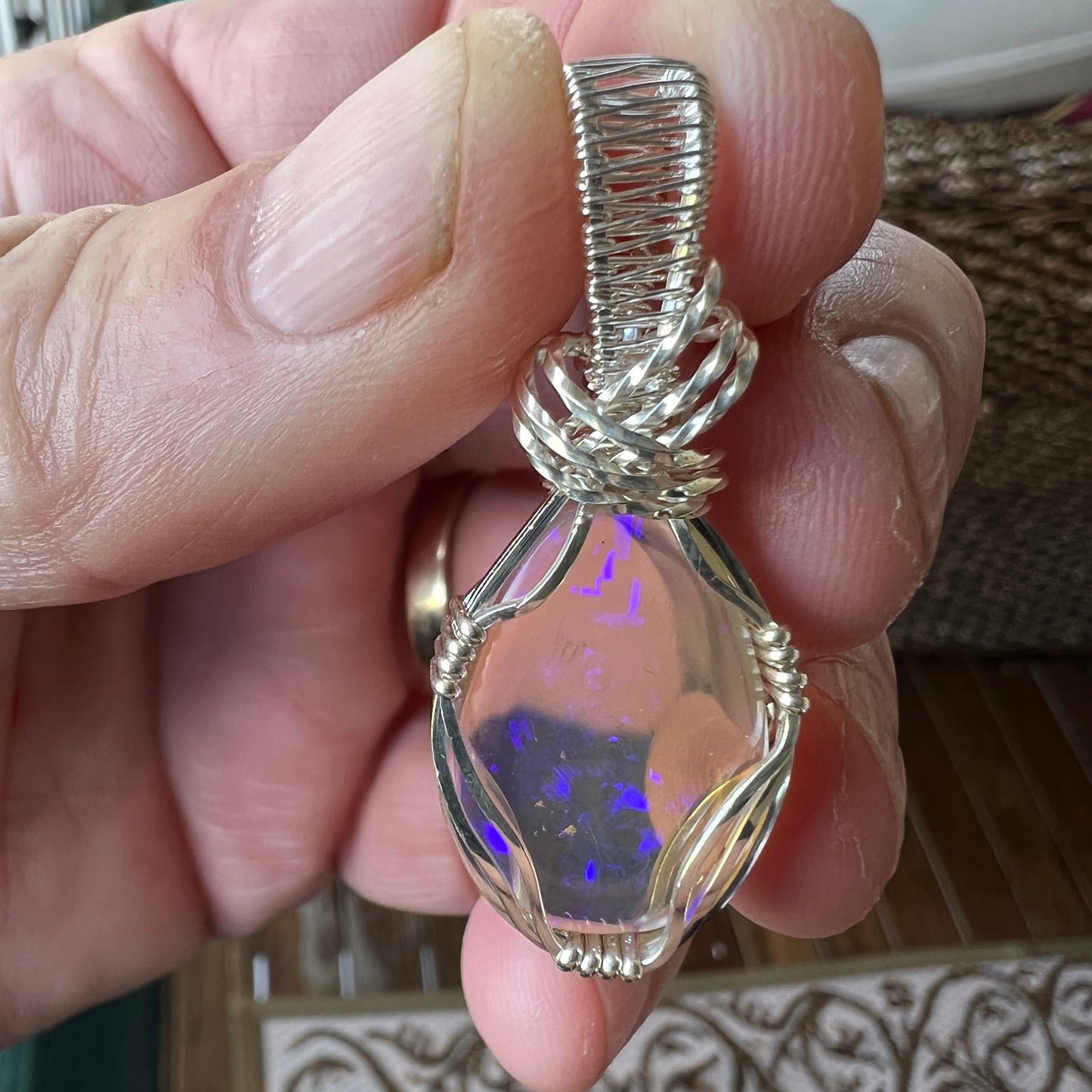Beautifully cut Lightning Ridge Jelly Crystal opal. Cut and expertly polished by Bill Johnson and set in a unique silver wire wrap. An awesome hand made gift.