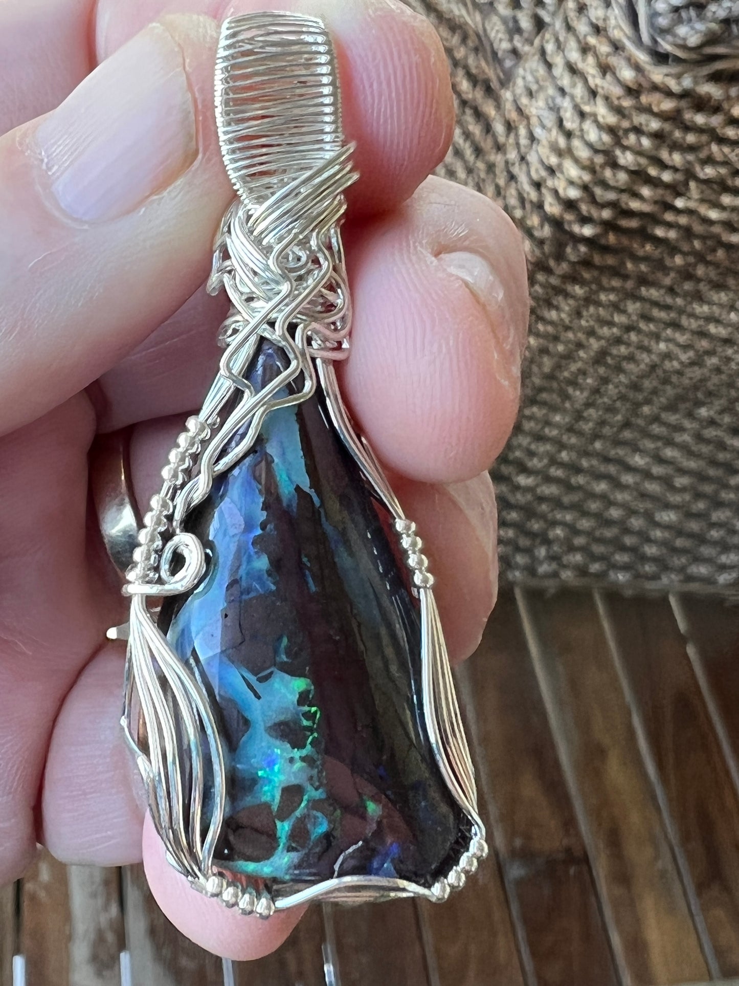 Awesome silver wire wrapped Winton Boulder opal pendant. A great statement piece with lovely colours.