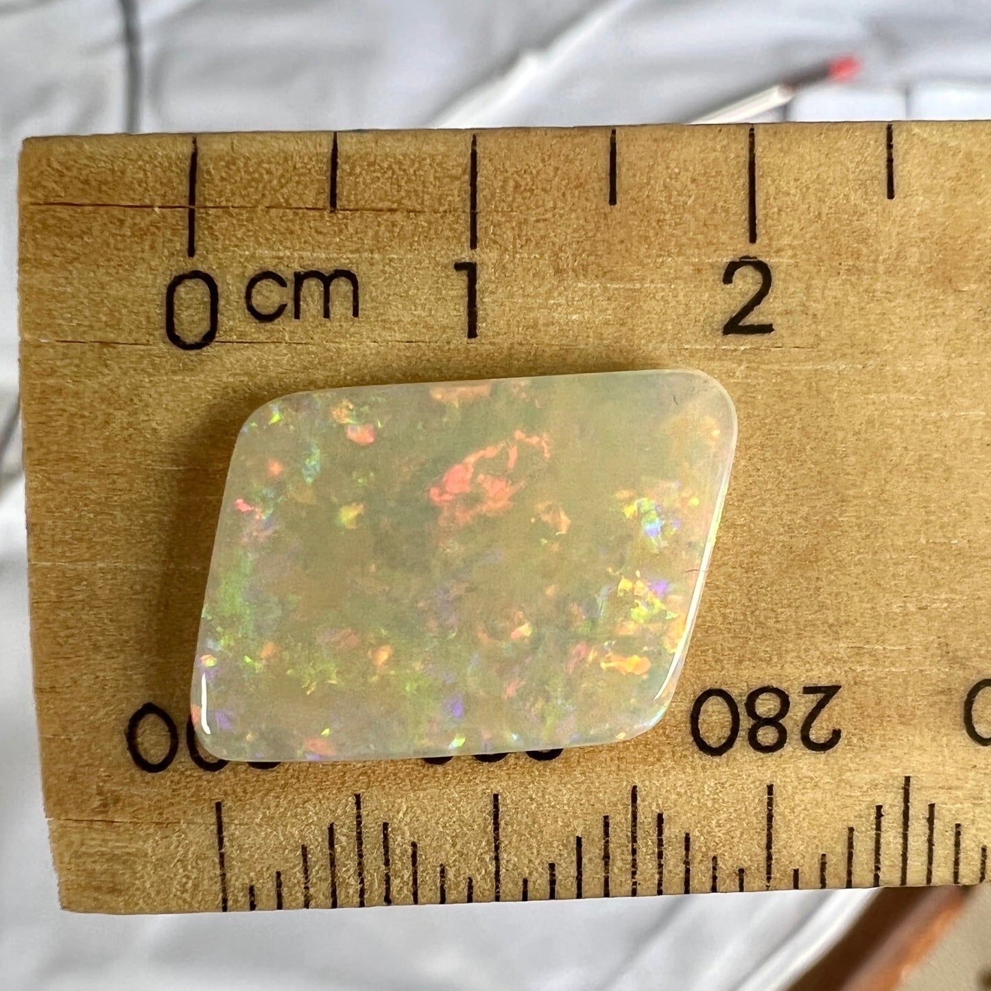 Wonderful Lightning Ridge solid semi black opal, showing all colours. A great shape.