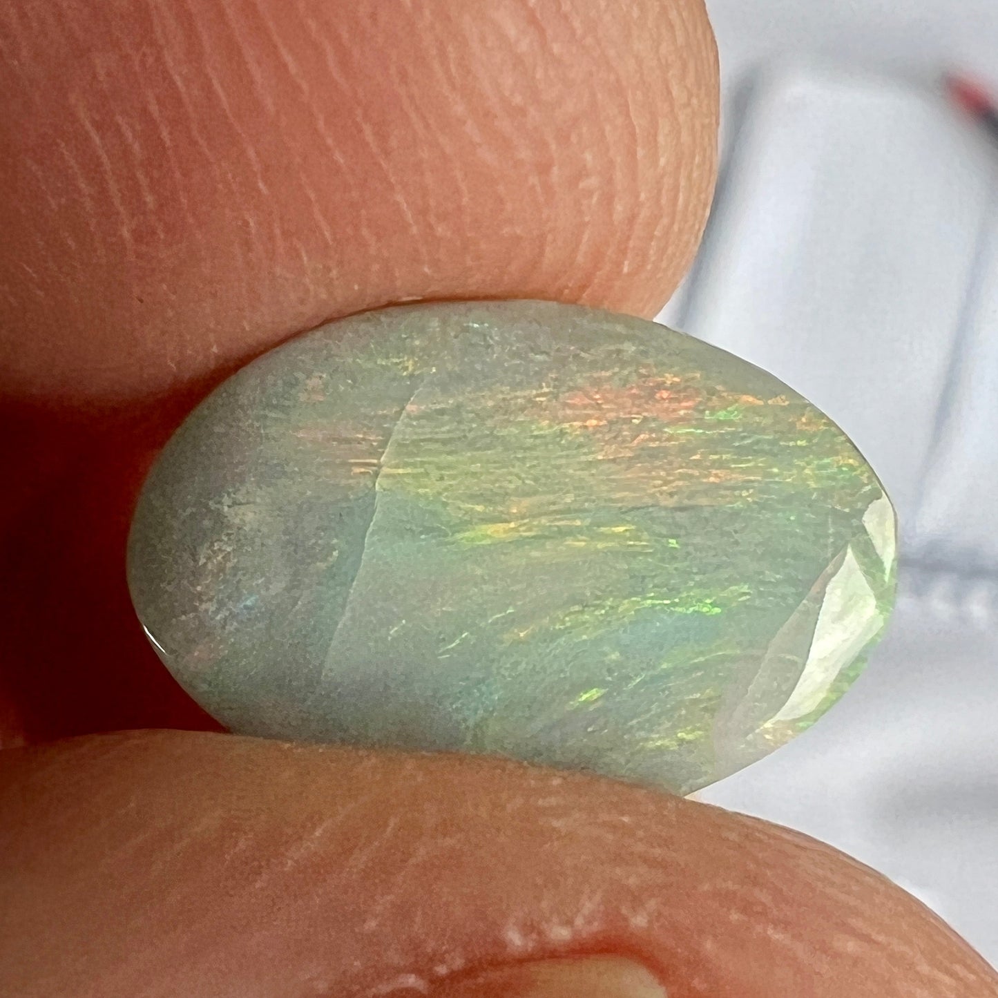 Lightning Ridge solid semi black opal with fantastic pattern and colours. Shaped to perfection.