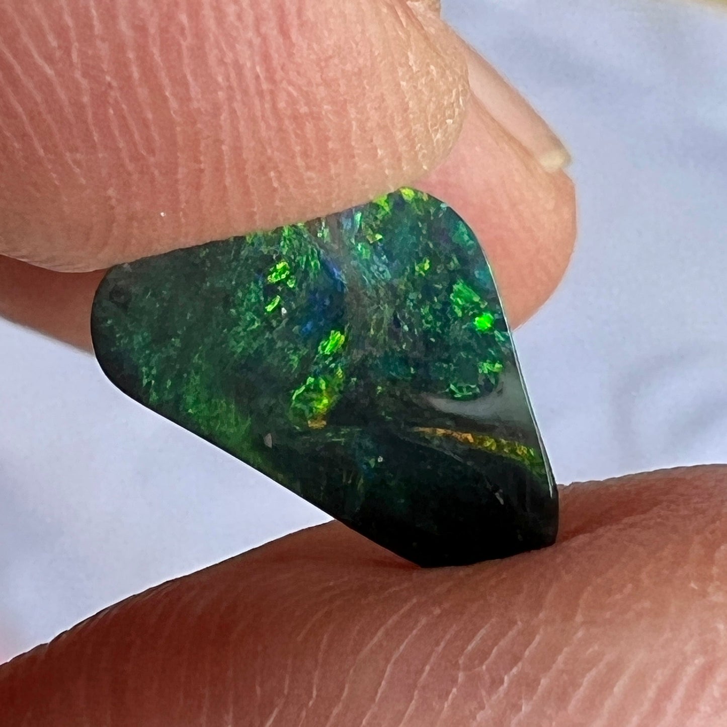 Solid black opal from Lightning Ridge with a beautiful play of greens.