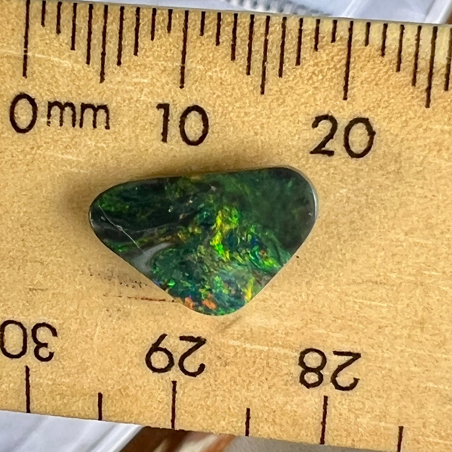 Solid black opal from Lightning Ridge with a beautiful play of greens.