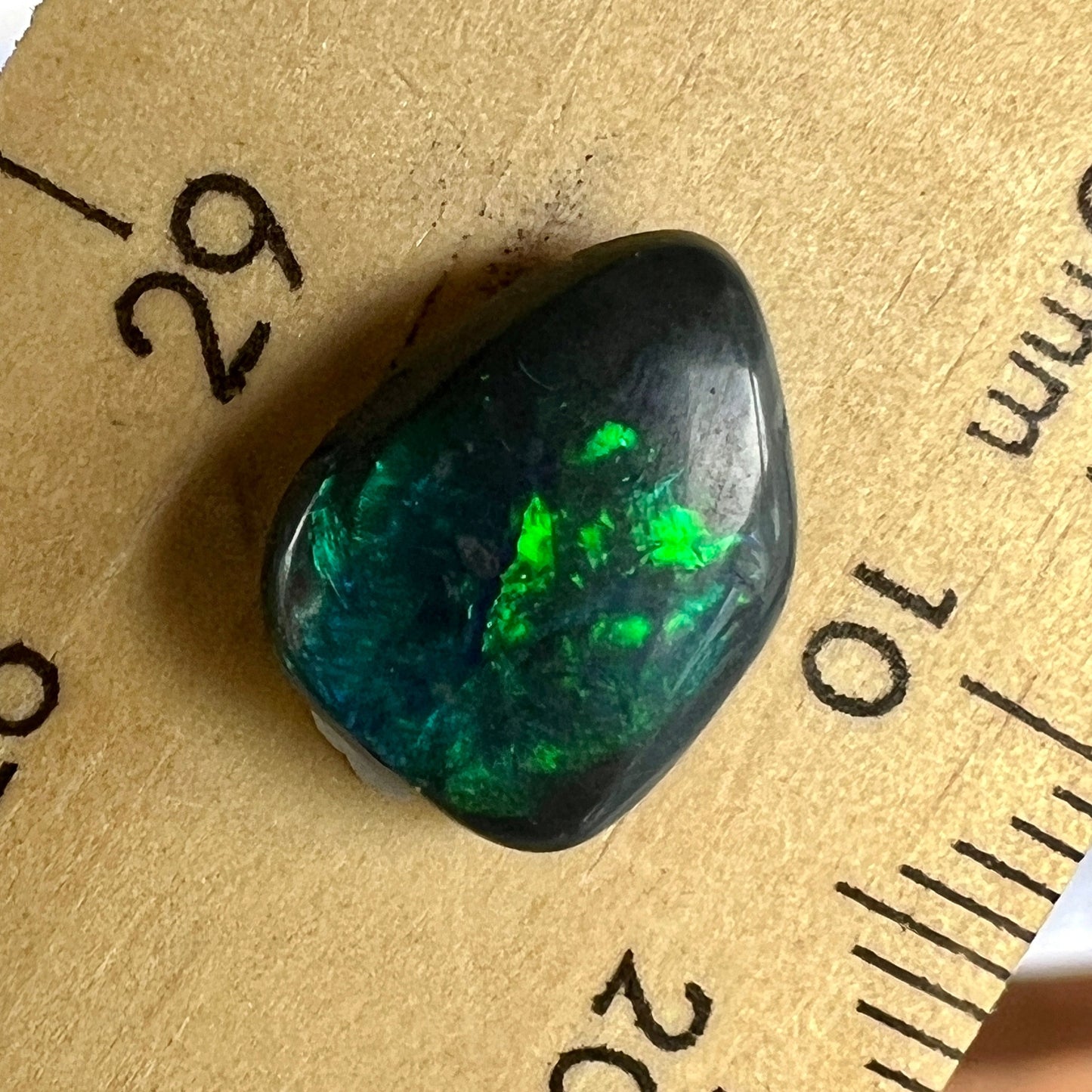 This solid black opal from Lightning Ridge is a beautiful stone. Requires an expert finish.