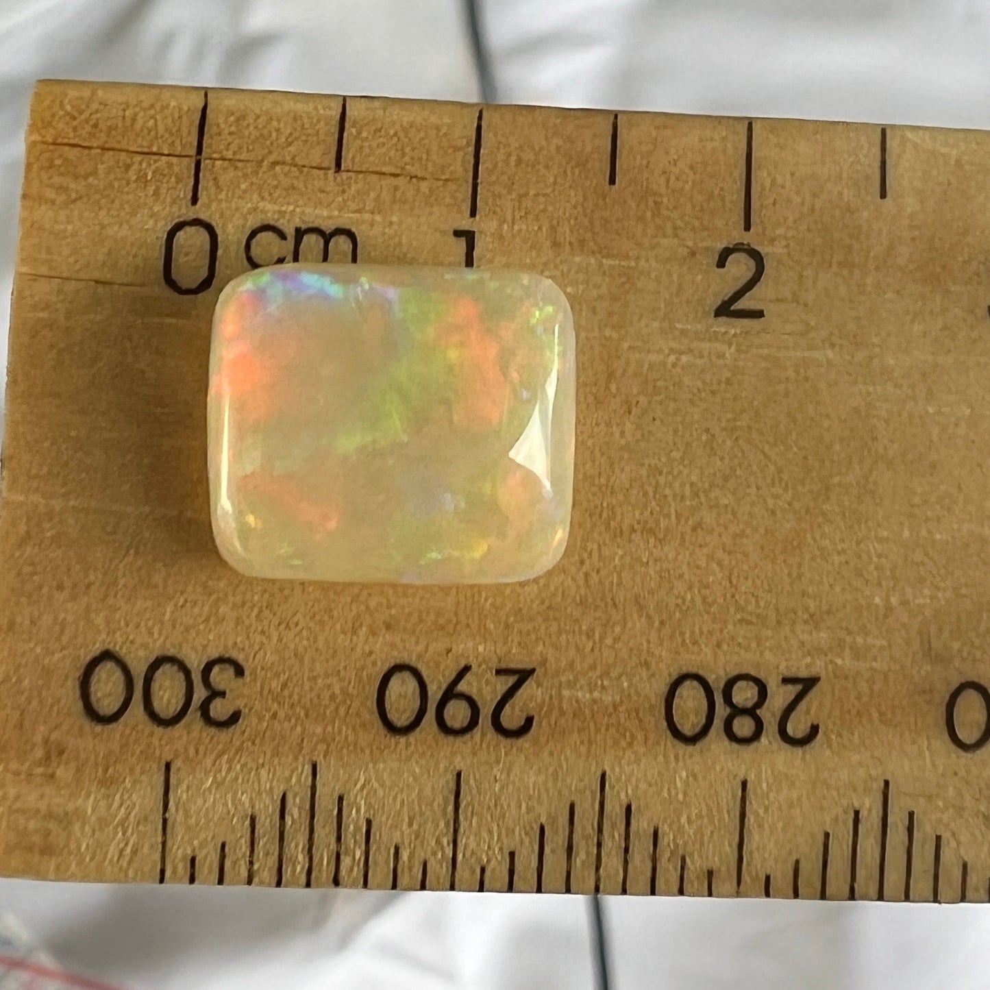 Beautiful Lightning Ridge cushion cut stone. Top polished wonderfully. Full of colour.