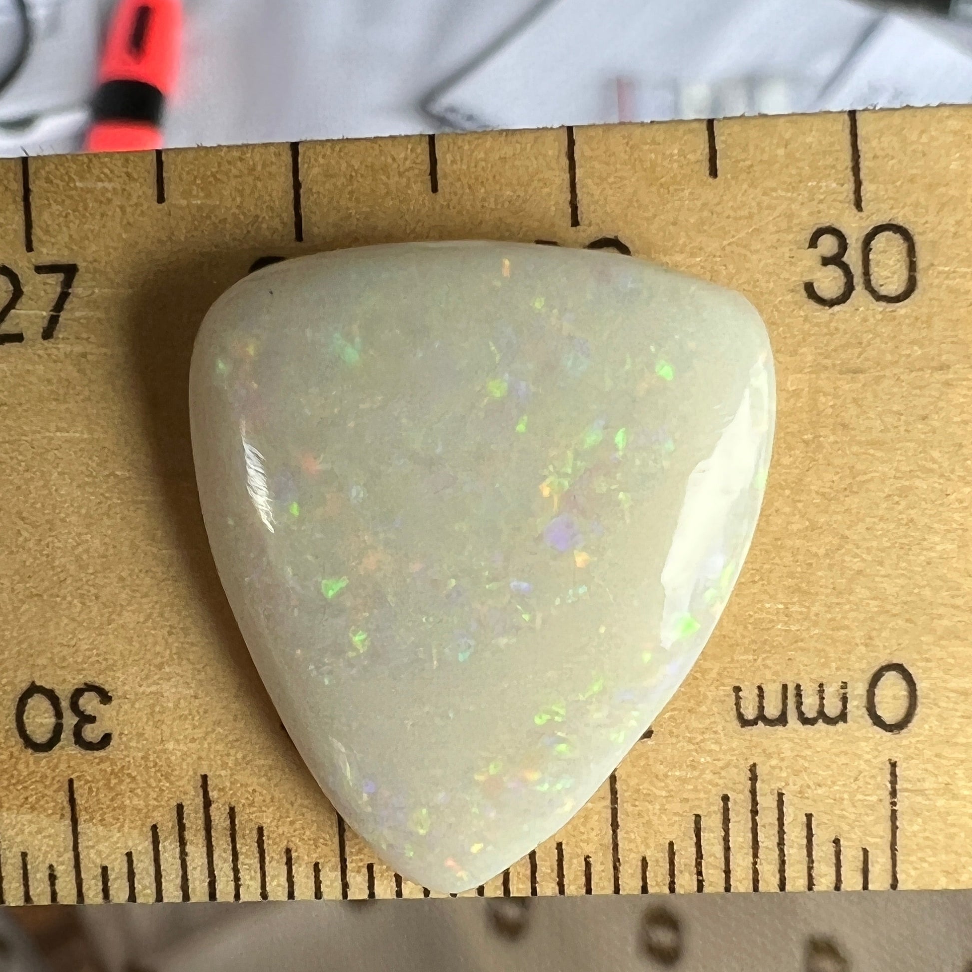 Coober Pedy solid white opal with Pin Fire colours. Quite large, and polished well, ready to make a pendant.