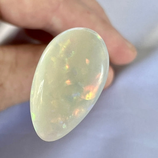 Stunning Coober Pedy opal displaying wonderful colours. Beautifully cut and polished, ready to set.