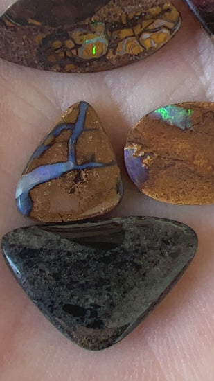 4 x Winton opals and 1 x Andamooka Matrix opal. Beautiful specimens showing lovely colours. Polished and ready to set.