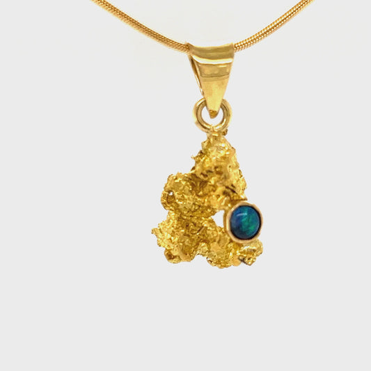 Pure solid gold nugget pendant from Western Australia, with an 18ct gold bale. Set with a beautiful solid black opal from Lightning Ridge.