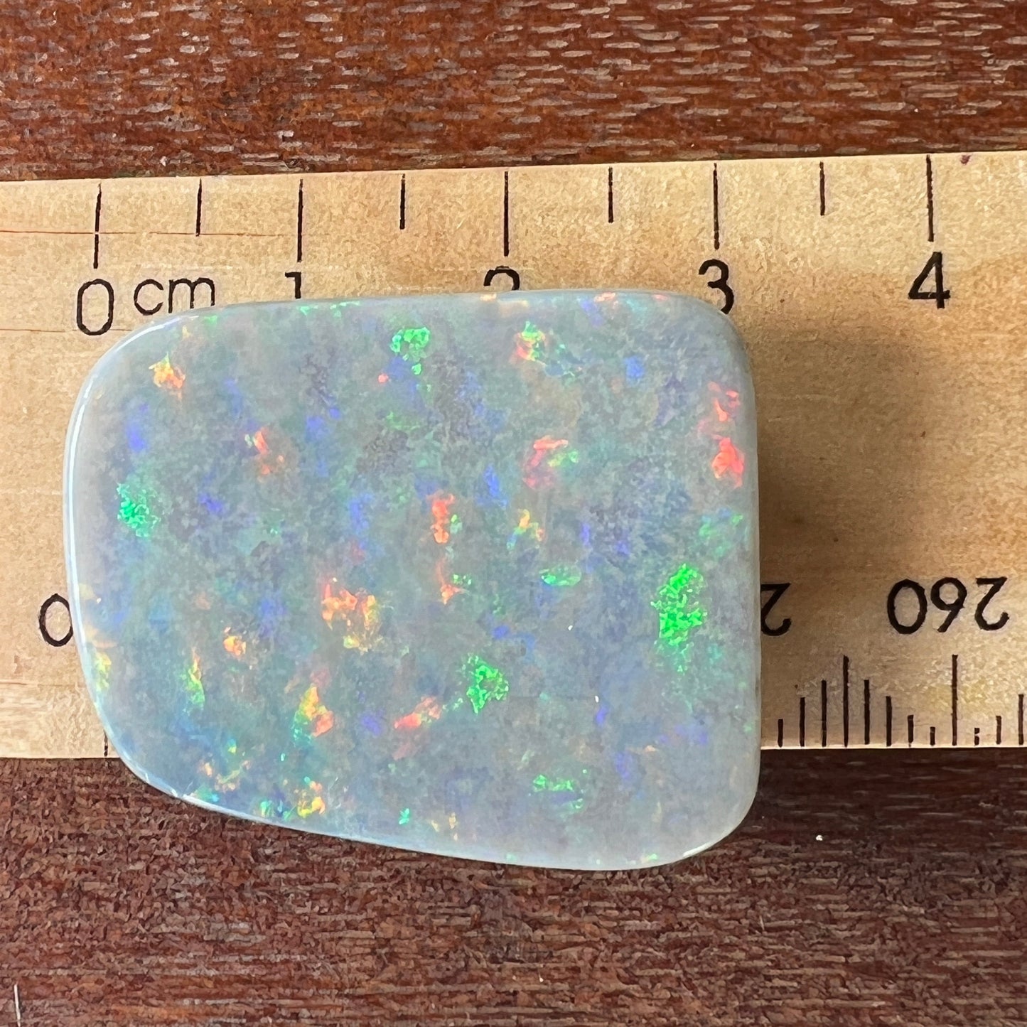 Lightning Ridge solid black opal, perfect pattern stone showing all colours. Outstanding cut and polish.