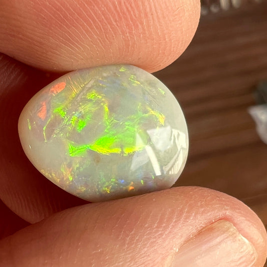 Rare Mintabie solid black opal, displaying vivid colours.