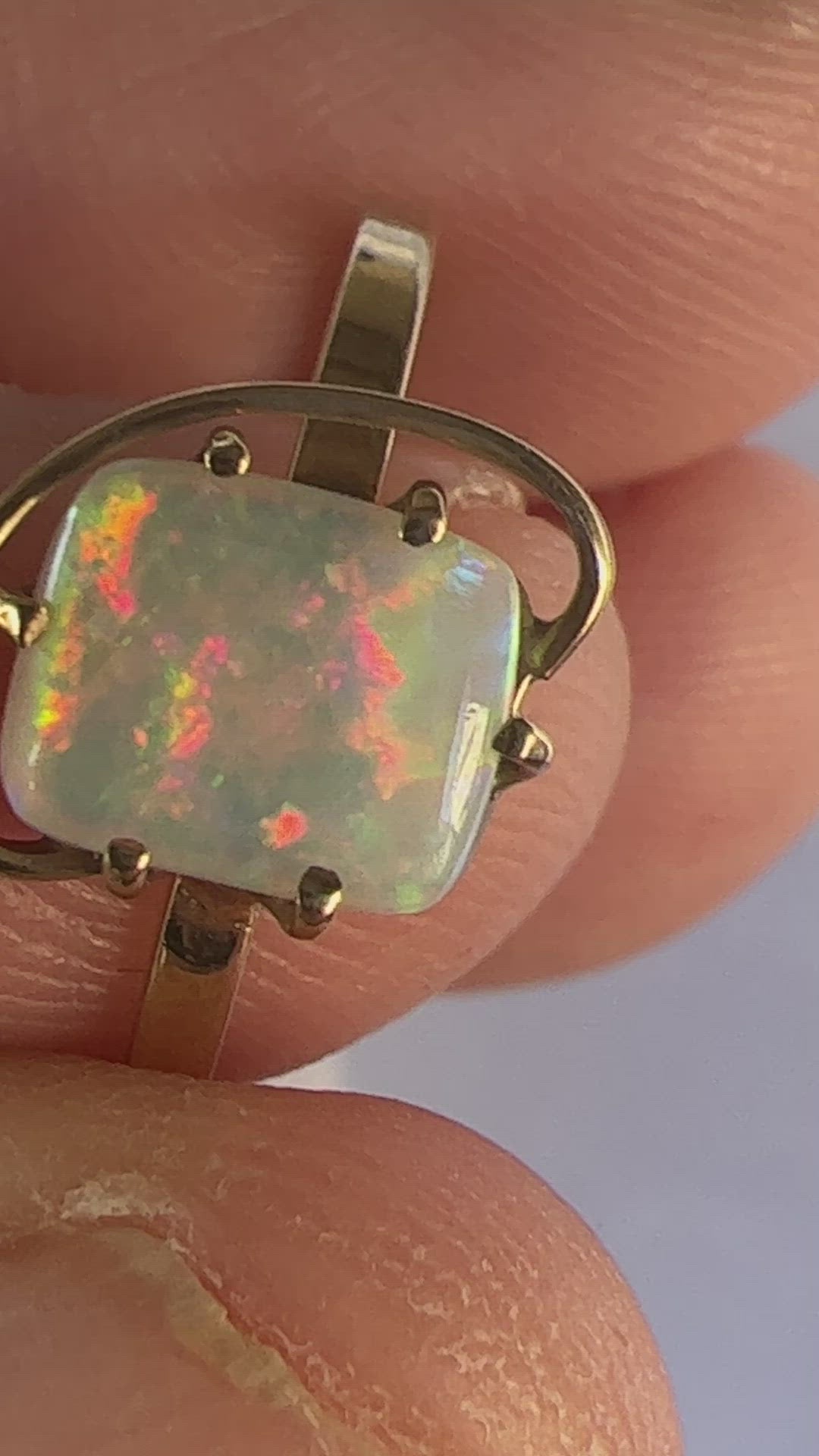 Great little one-off 14ct gold ring featuring a cushion cut Coober Pedy crystal opal. Displays breathtaking colours.