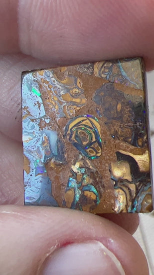 Square cut boulder opal from Winton, displaying great colours and pattern.