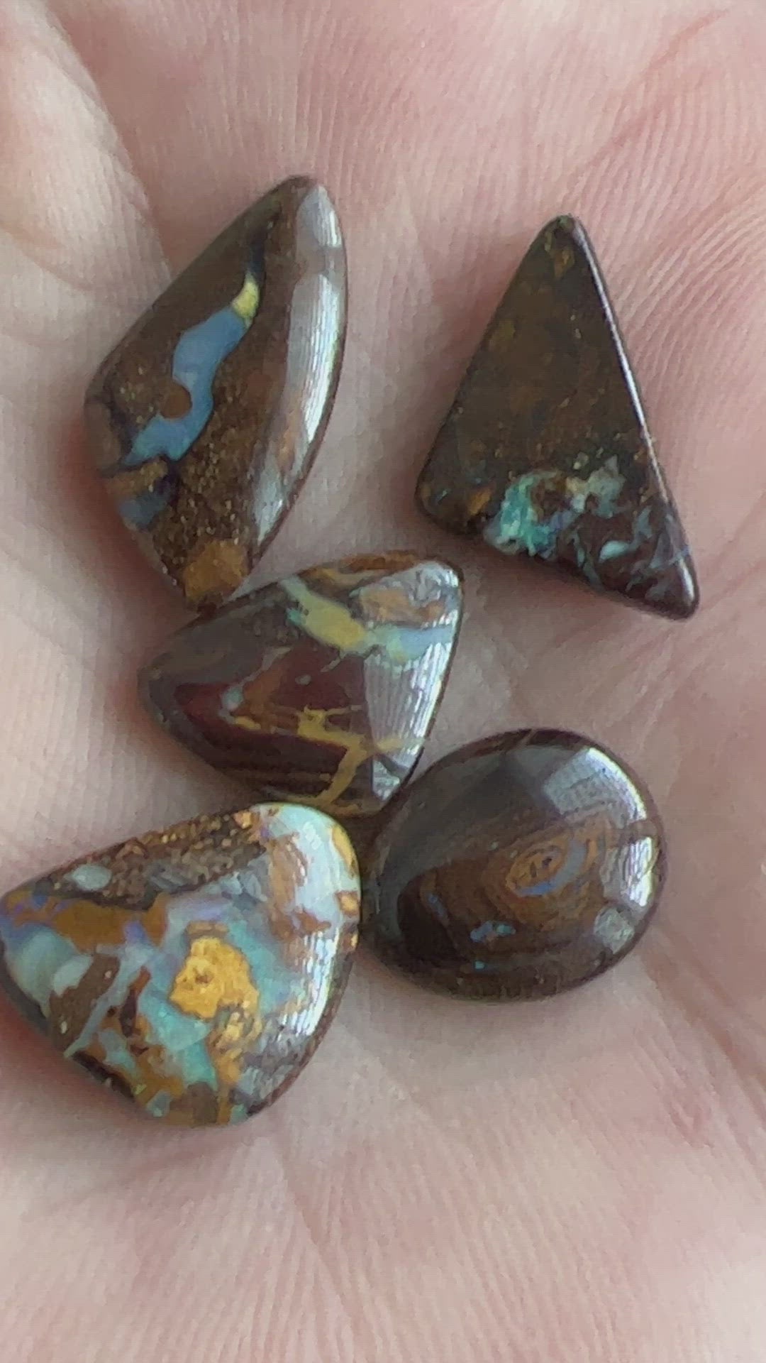 Boulder opal bundle containing 5 beautiful opals from Winton, Queensland. Polished and ready to set.