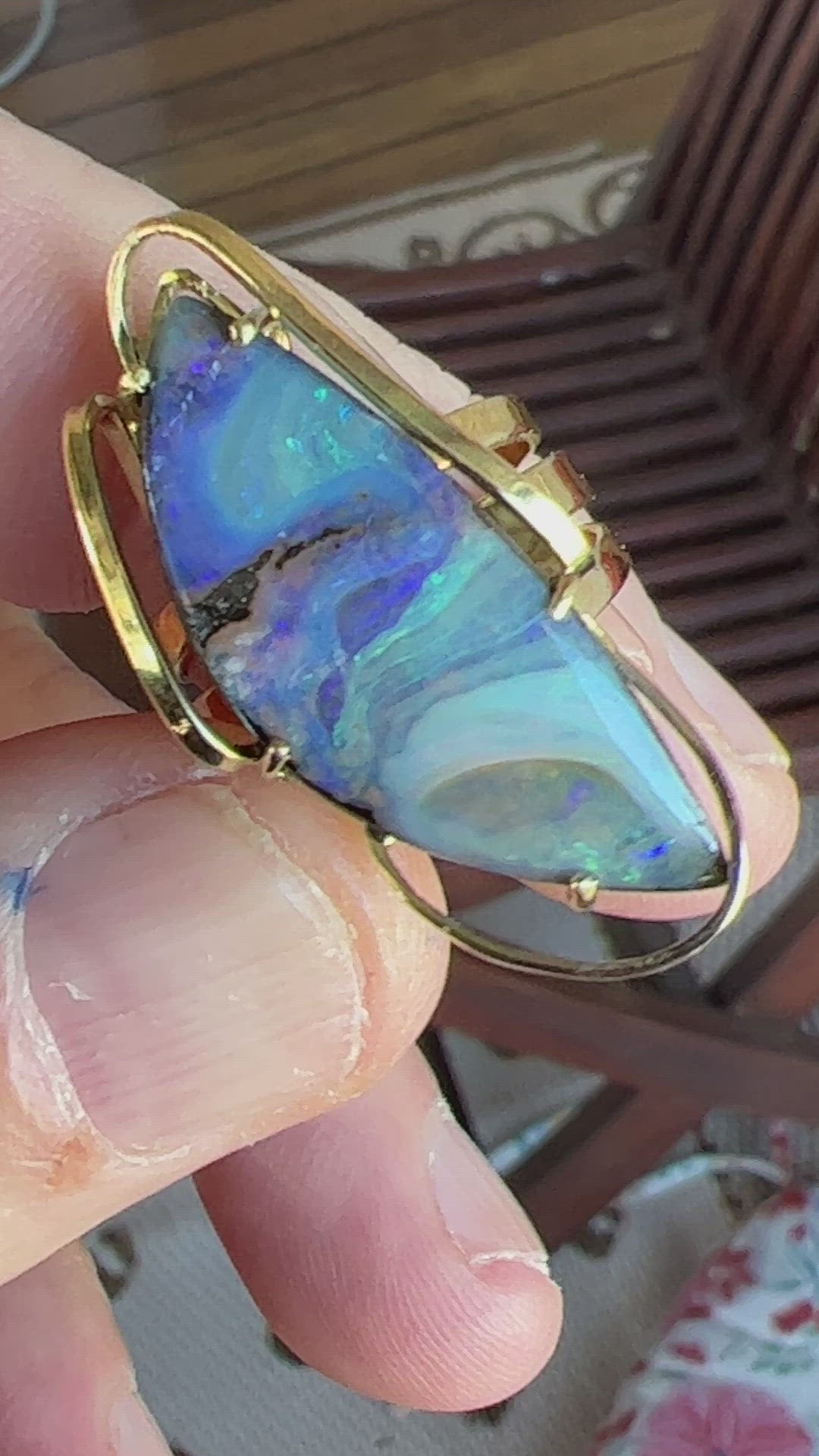 A beautiful statement ring custom made with rare Queensland Boulder opal. The stone has a perfect polish and is set in a wonderful 14ct gold triple ring.