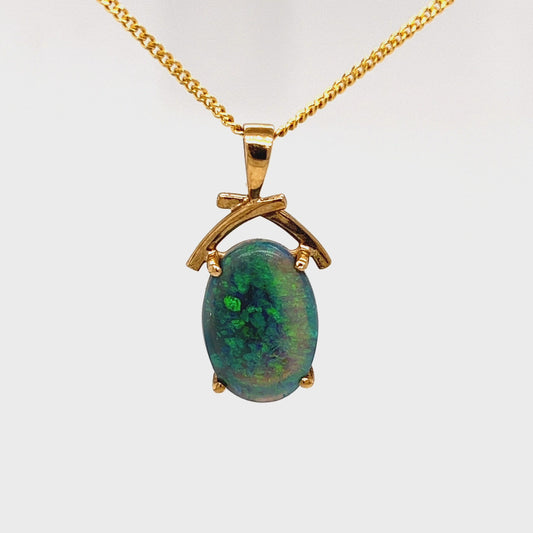 Beautifully cut Lightning Ridge Crystal opal displaying awesome greens. Set in a 14ct gold pendant. Cut and polished by Bill Johnson. Priced to sell.