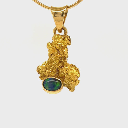 Pure gold nugget pendant from Western Australia, perfectly set and balanced with an 18ct gold bale. Set with a beautiful Lightning Ridge solid black opal.
