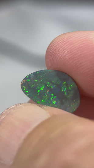 Lightning Ridge gem quality semi-black solid opal. Ready to make into that perfect ring or pendant. Beautiful greens and blues with a hint of reds. 