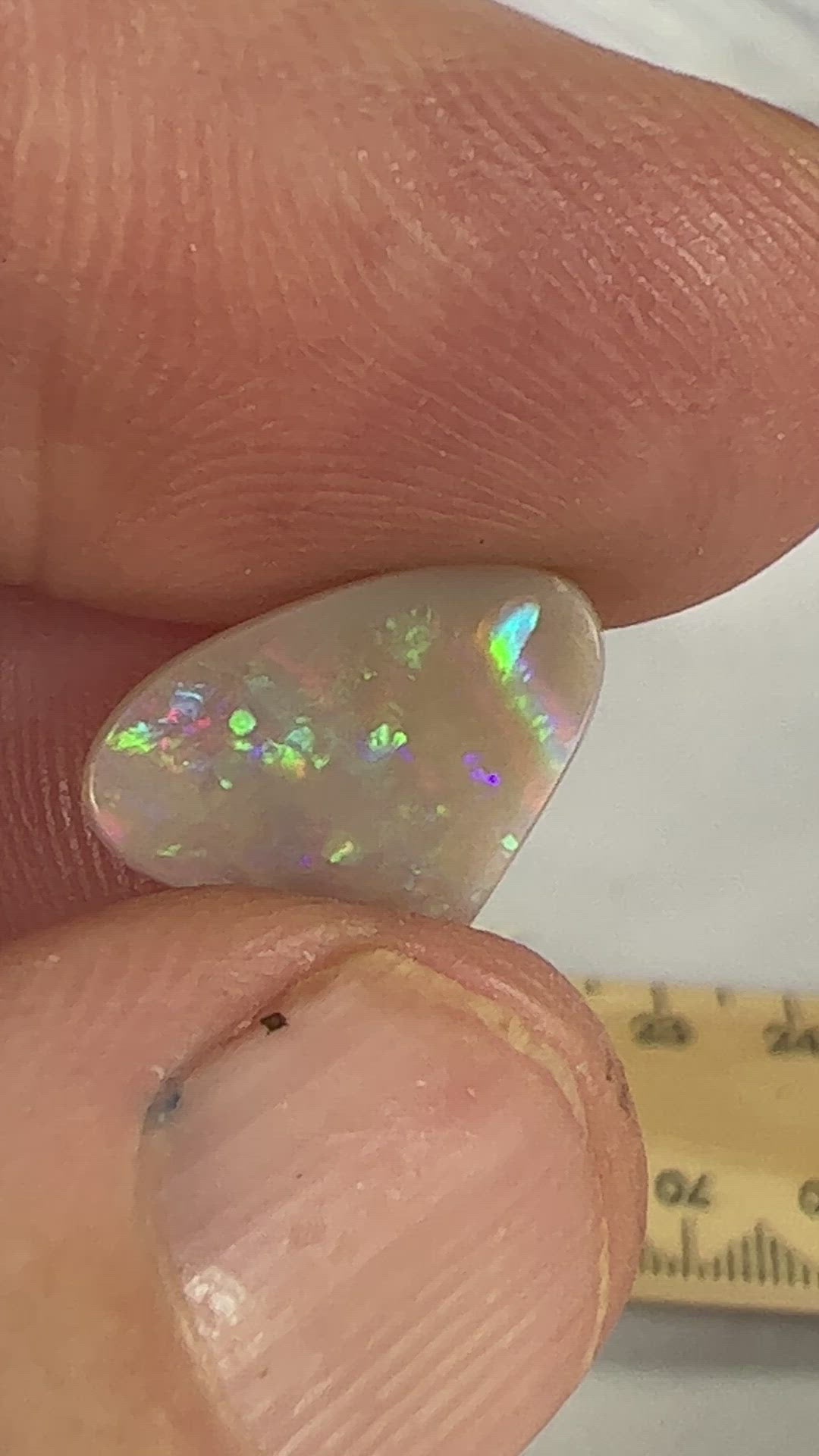 Nice semi black opal from Lightning Ridge, displaying brilliant flashes of colour.