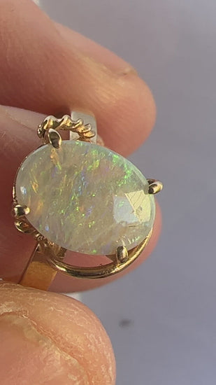 Nice bespoke Coober Pedy crystal opal set in 14ct gold with a twist! 