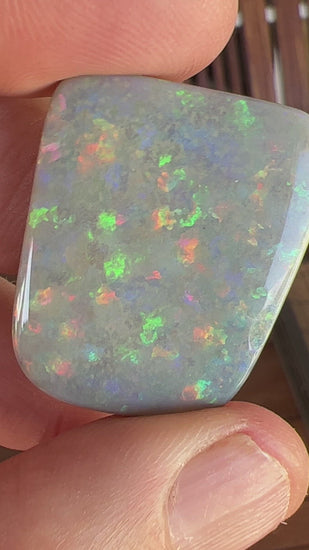 Large Lightning Ridge solid black opal, perfect pattern stone showing all colours. Outstanding cut and polish, weighing in at 38.5ct.
