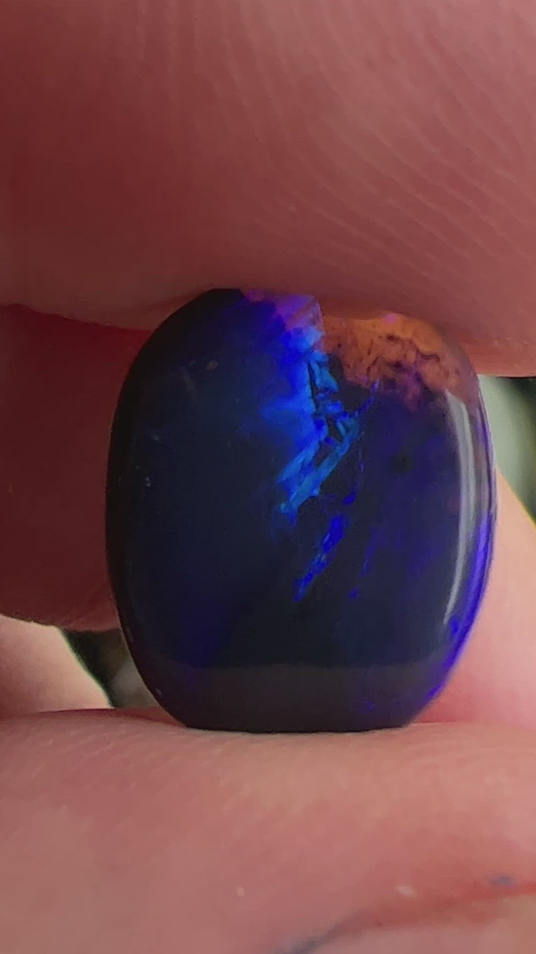 Lightning Ridge Blue on Black Opal. Nice dome and polish. Clear on one end. Can be cut down or left as is, hence discounted price.