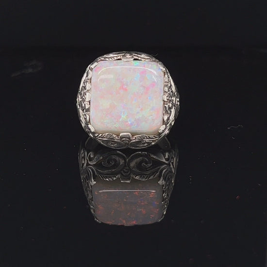 Magnificent handmade silver ring  featuring a beautiful cushion cut 10ct Coober Pedy opal, displaying a wonderful full array of pinfire colours. One of a kind.