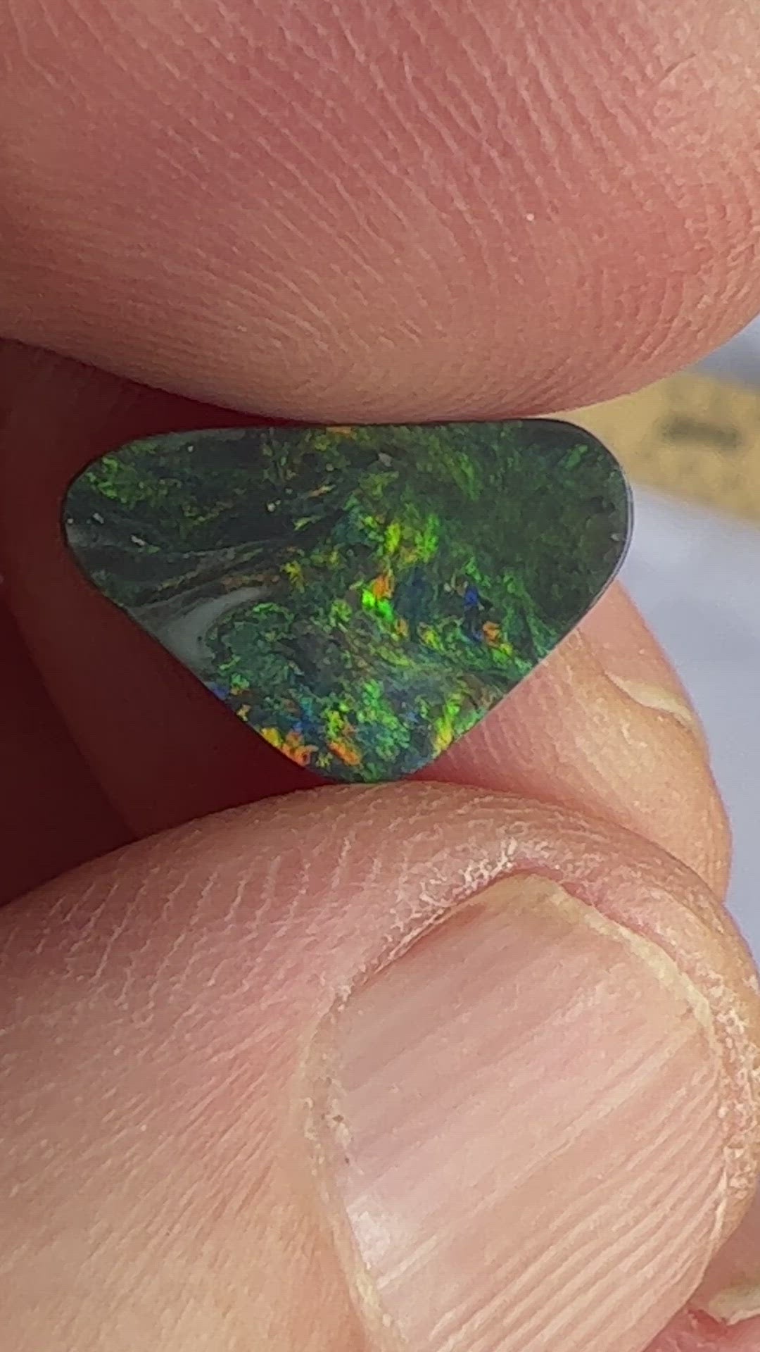 Solid black opal from Lightning Ridge with a beautiful play of greens.