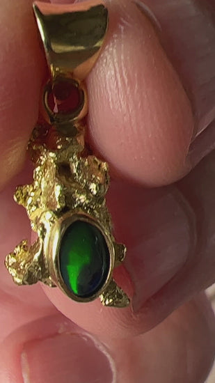 Pure solid gold nugget pendant from Western Australia. Perfectly set with a 18ct gold bale. Set beautifully with a solid black opal from Lightning Ridge.