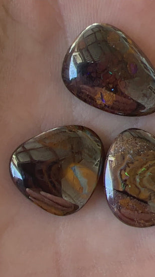 Four lovely pieces of boulder opal from Winton. Nice dome and polish showing great colours.