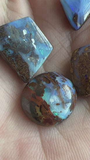 Bundle of four awesome boulder opals from Winton. Polished and ready to set.