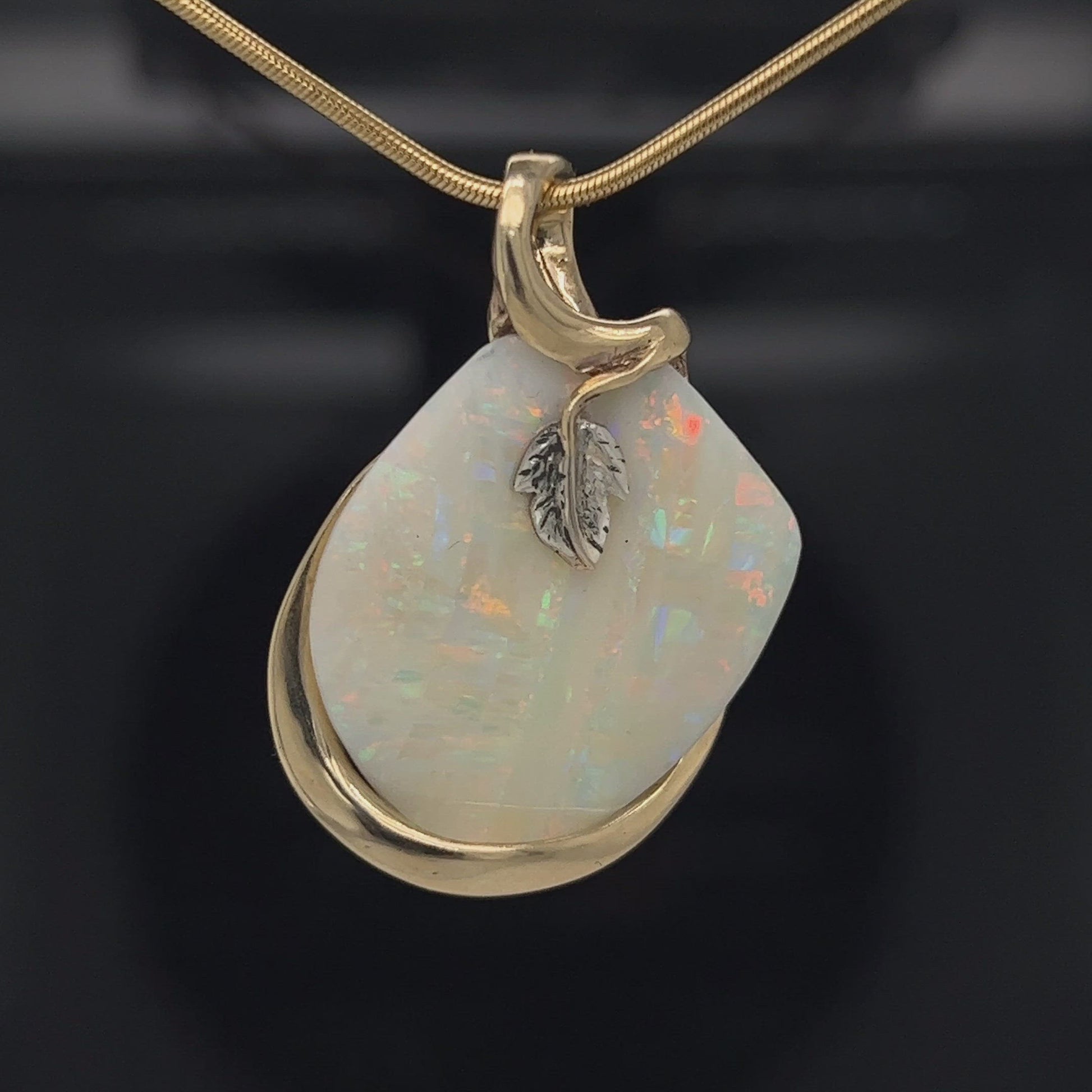 Beautiful solid vertical Mulga opal from the mines of Craig Haxton in Lightning Ridge. Gorgeous yellow gold and white gold setting with a platinum leaf, showcasing all of the Autumnal colours. Another Sally Fisher masterpiece.