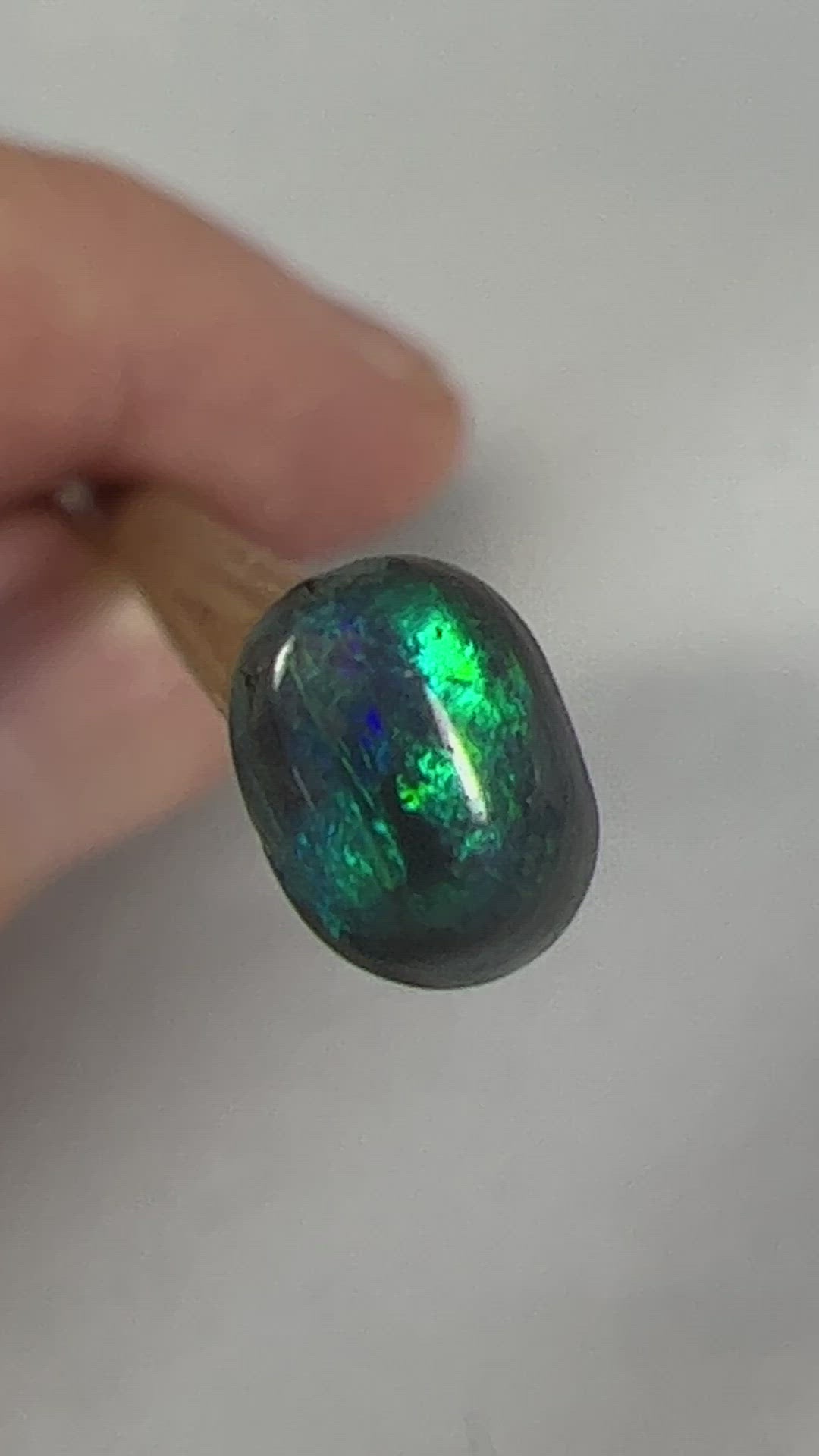 Nice little solid black opal from Lightning Ridge, displaying beautiful greens. Would make a great ring stone.