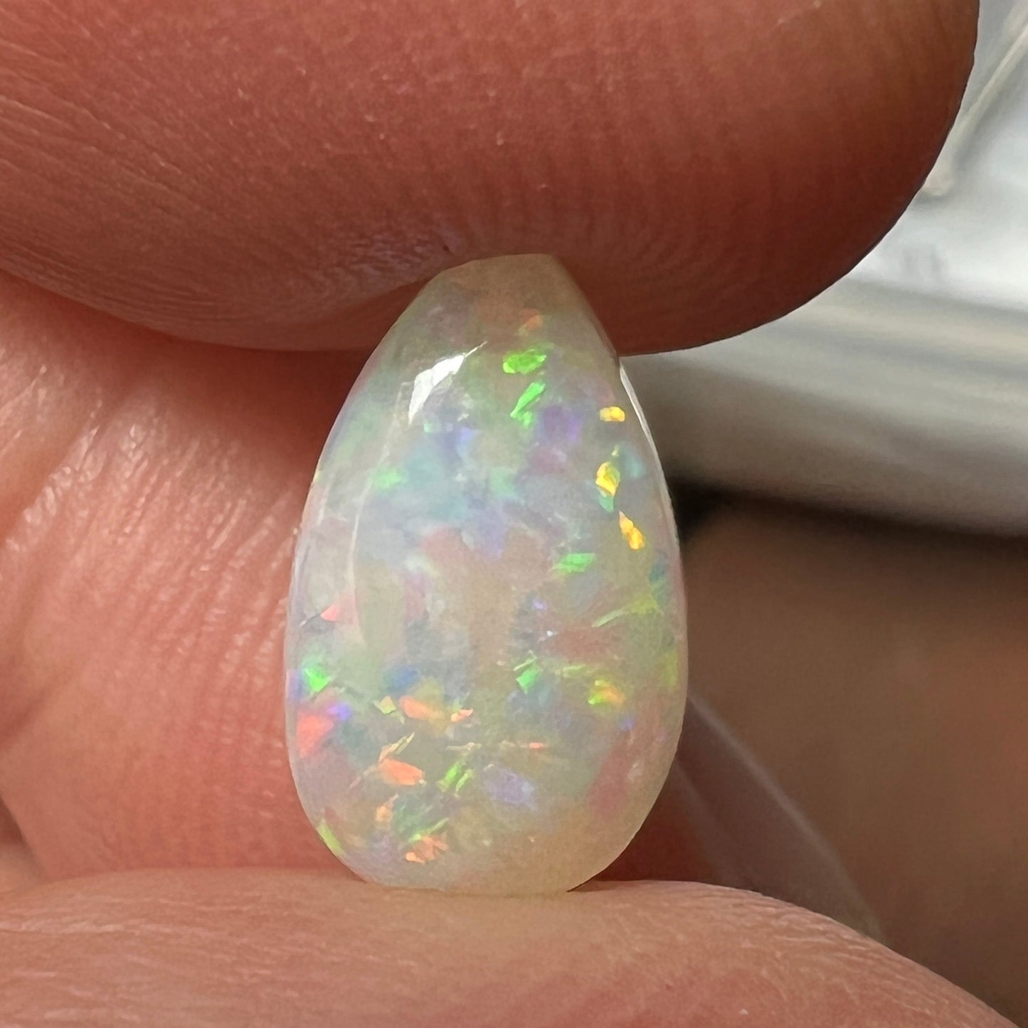 Gorgeous solid opal displaying an array of magnificent colours. Cut and polished to perfection, and ready to set.
