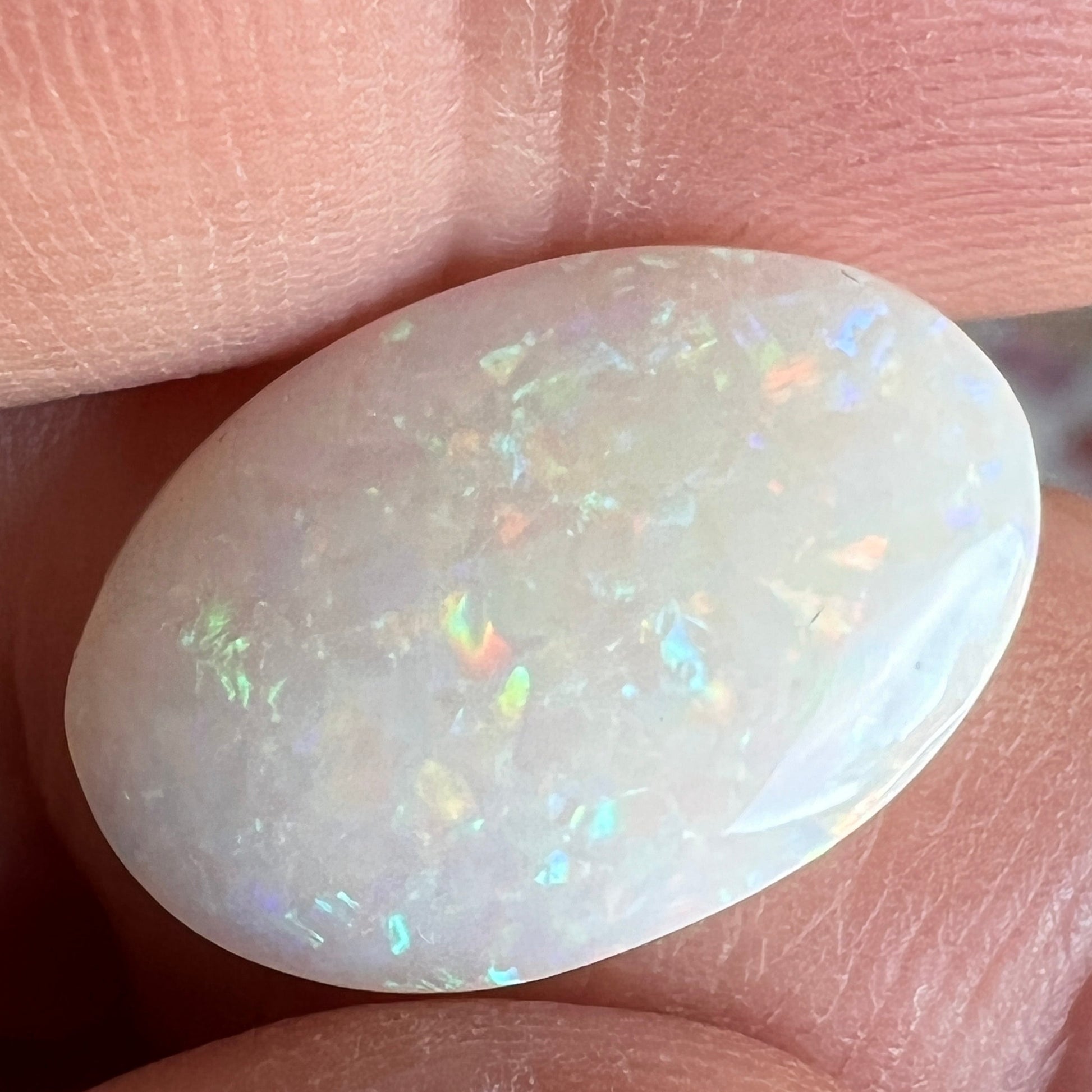 Double sided Coober Pedy solid white opal. beautifully displaying all colours in a pin fire pattern. Ready to go.