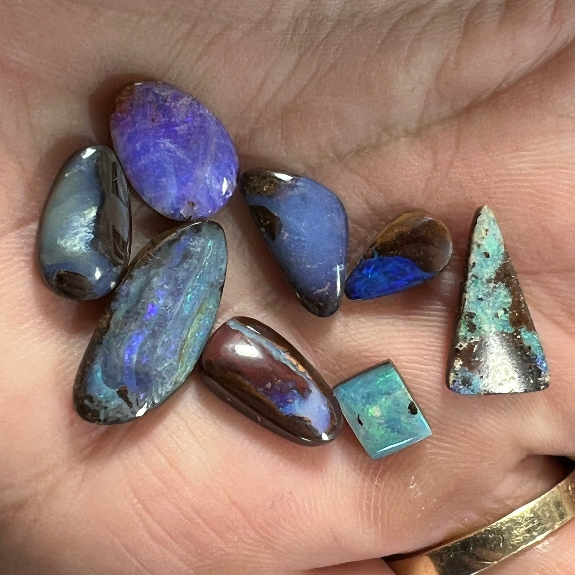 Eight pieces of beautiful boulder opal from Winton. A lovely array of colours.