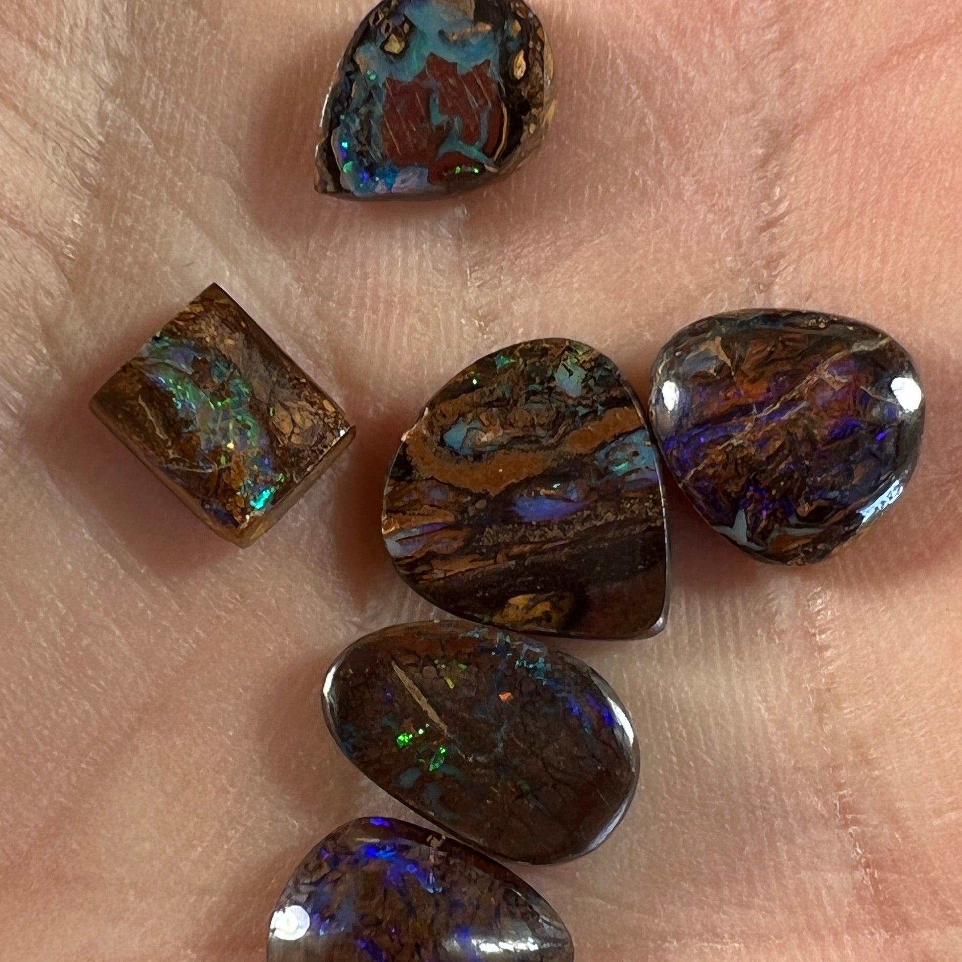 Six lovely boulder opals. Great little coloured pieces.