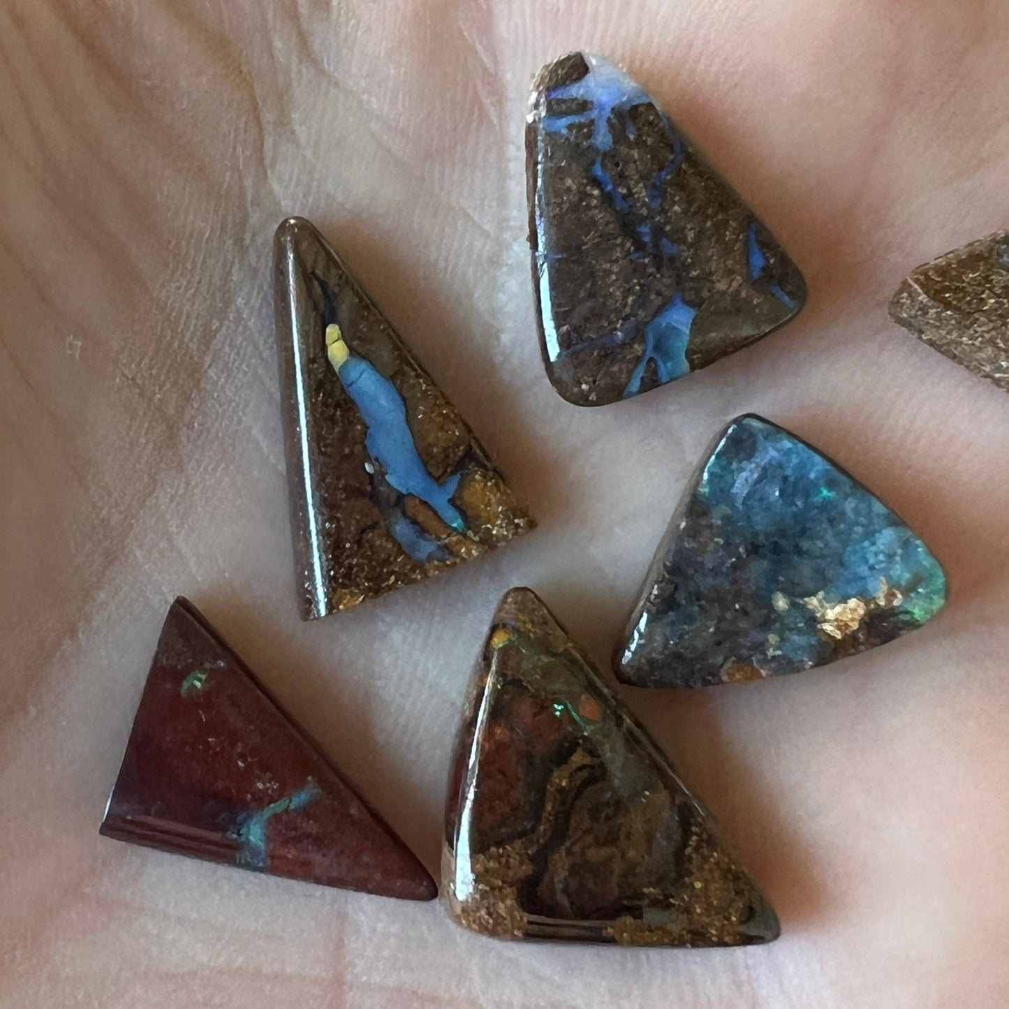 Nice boulder opal bundle from Winton in great triangular shapes. Lovely colours in all six stones.