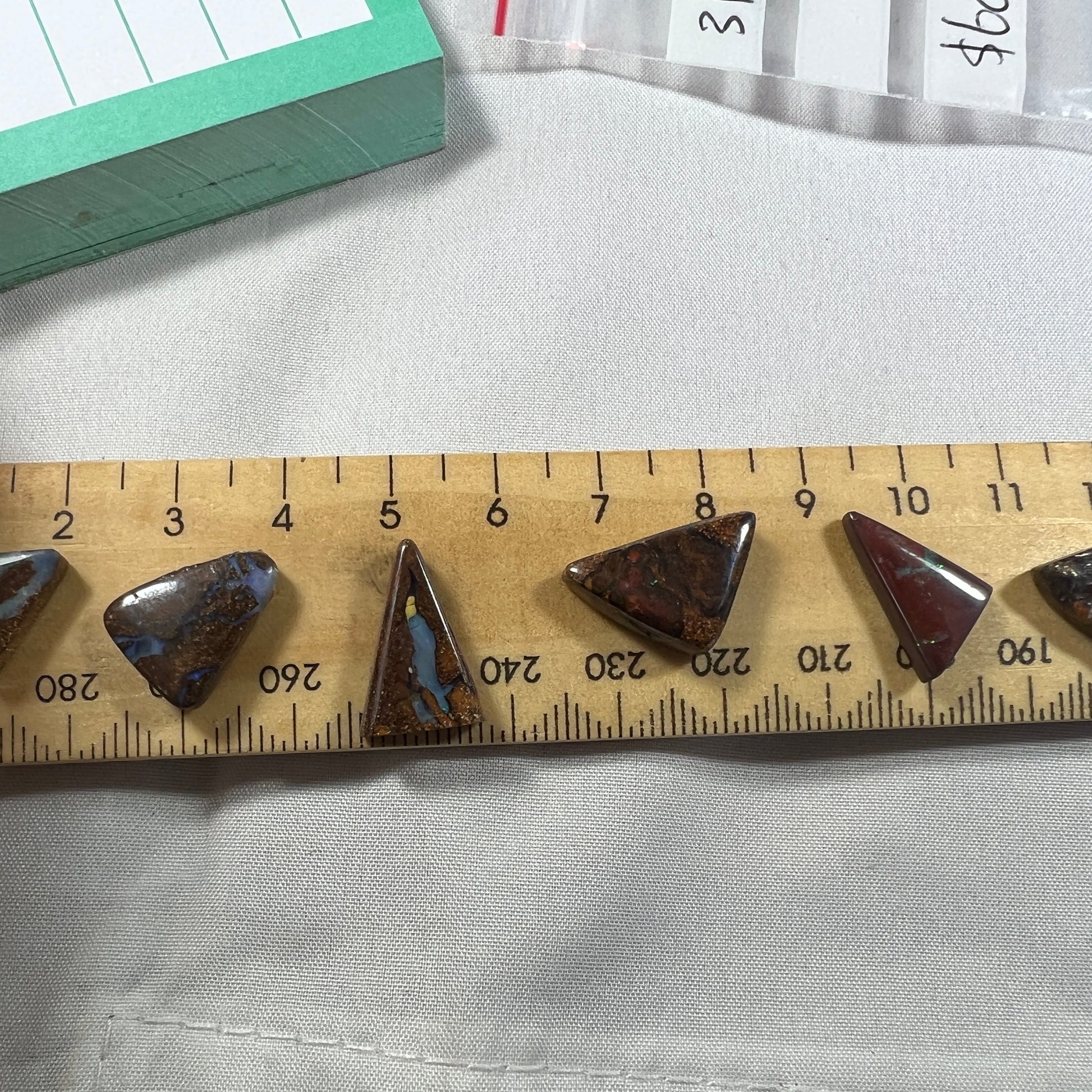 Nice boulder opal bundle from Winton in great triangular shapes. Lovely colours in all six stones.