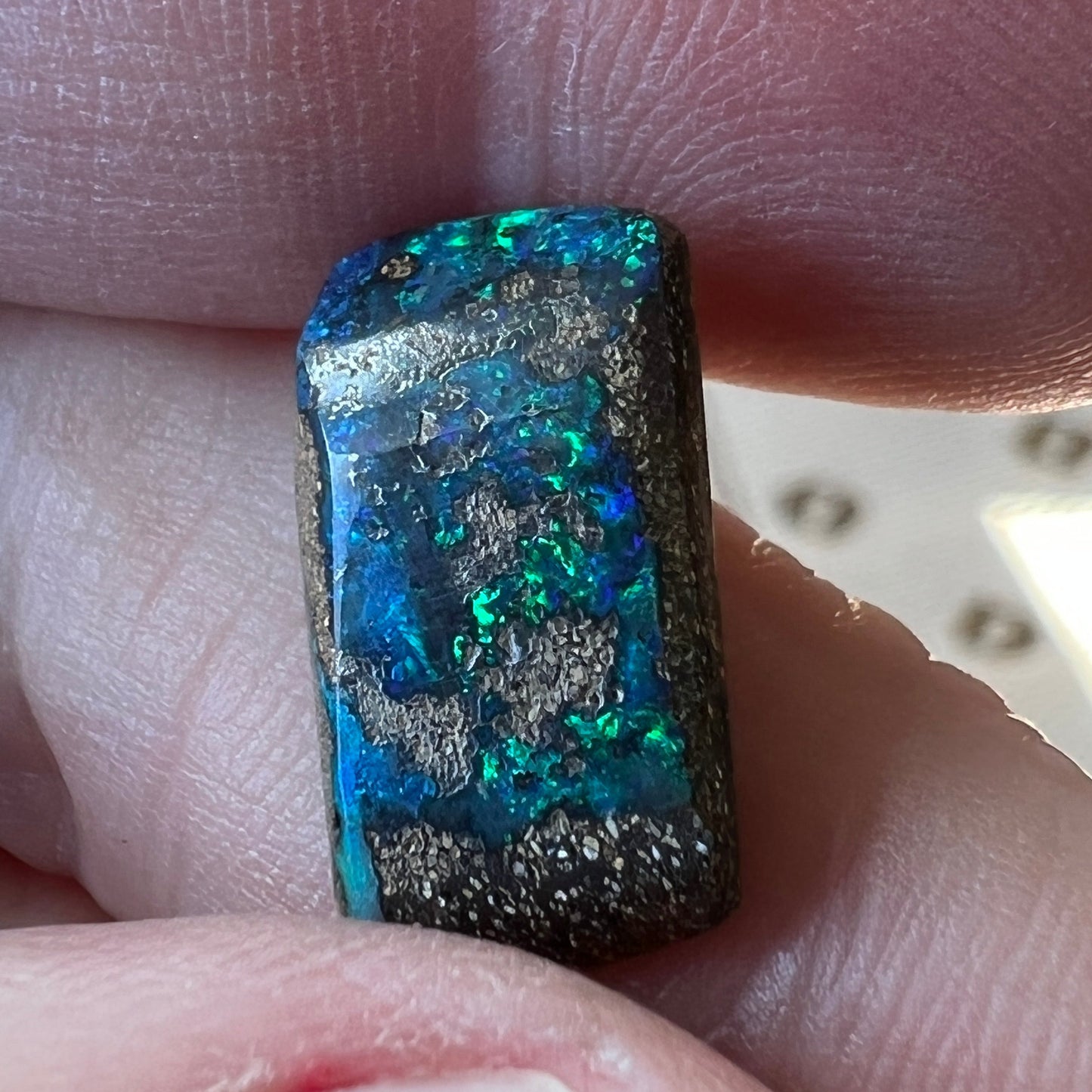Nice greens and blues are shown within this lovely Winton boulder opal.