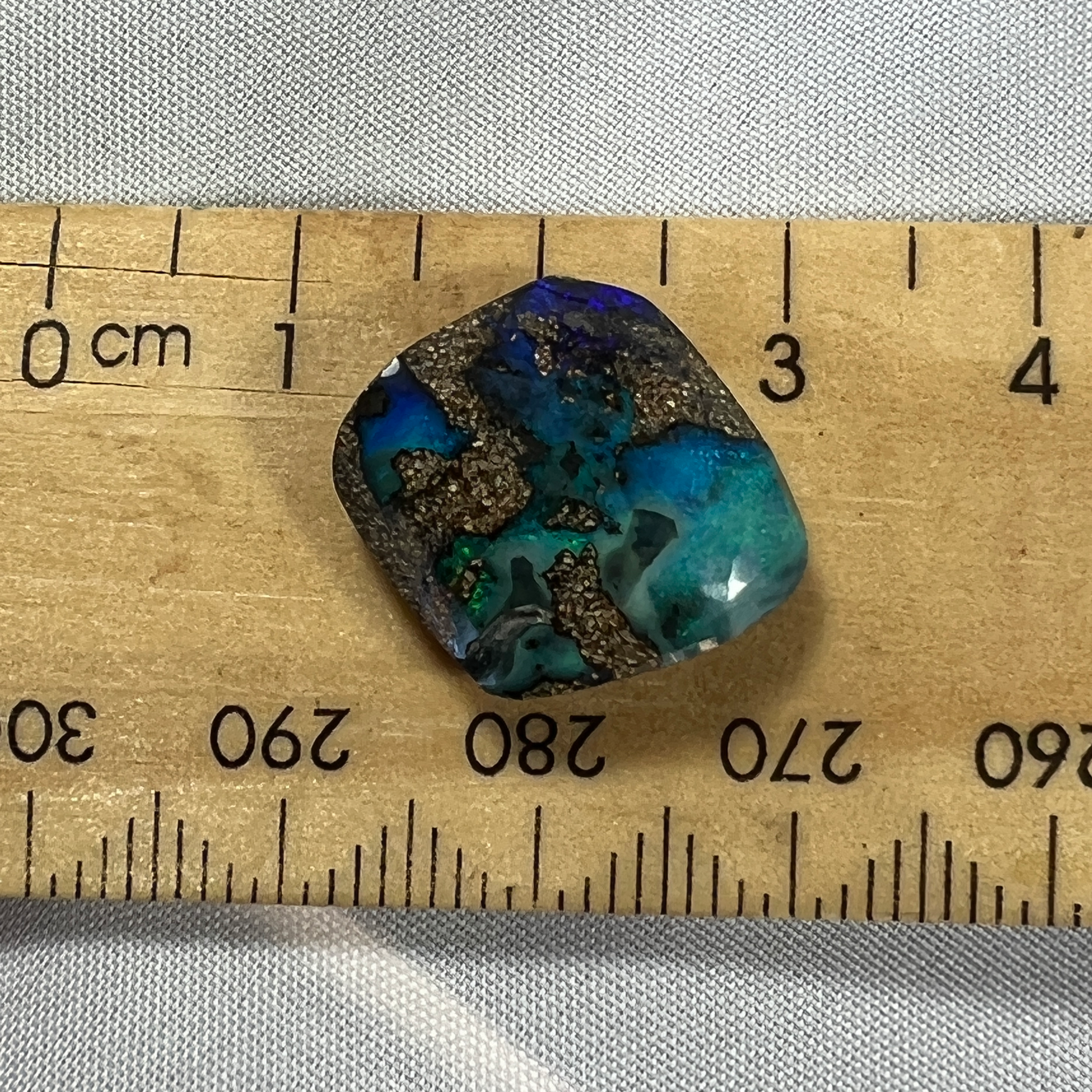Beautiful greens and blues are displayed in this nice piece of Queensland boulder opal.