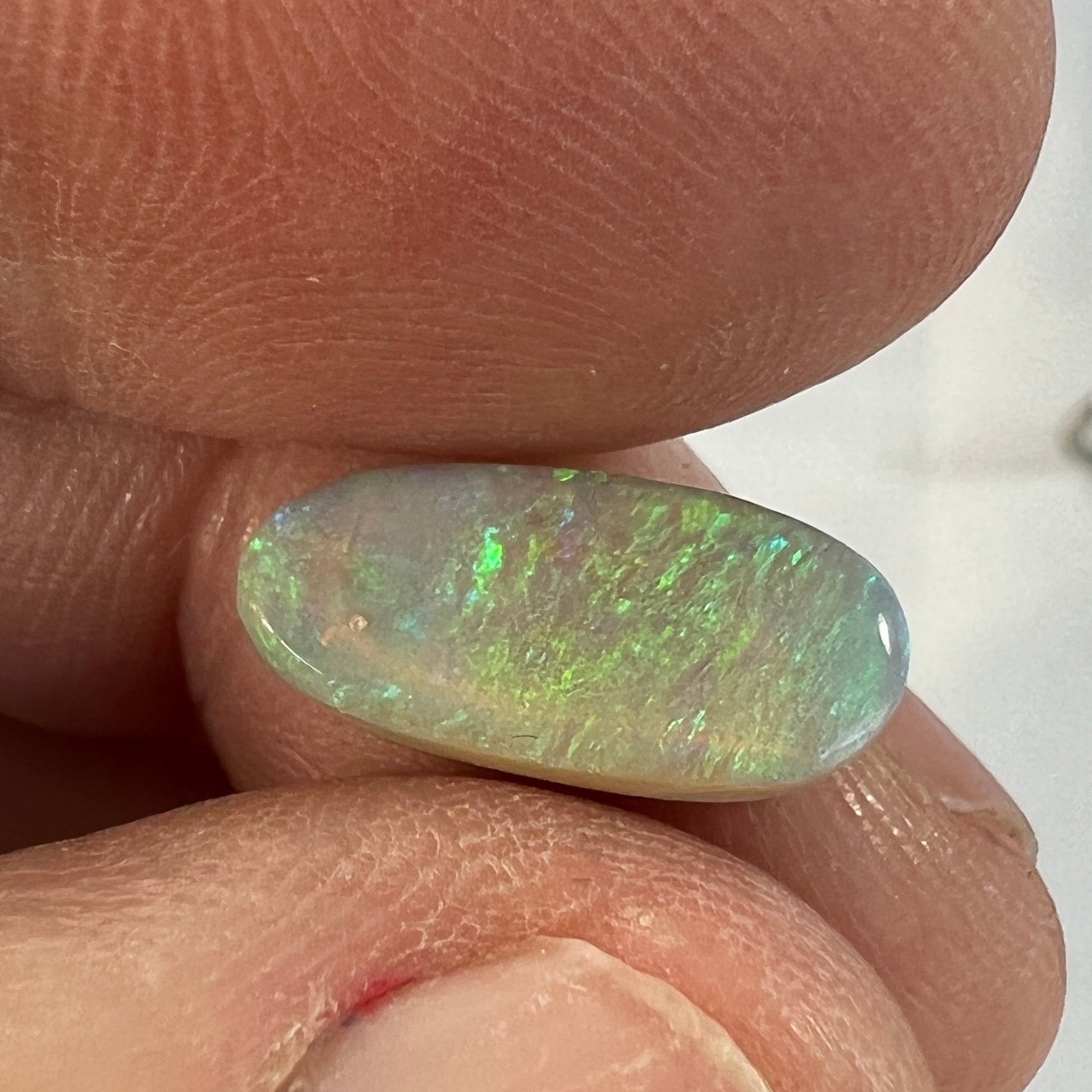 Lightning Ridge grey/green solid opal. Slight sand spot, should rub out, hence the discounted price.