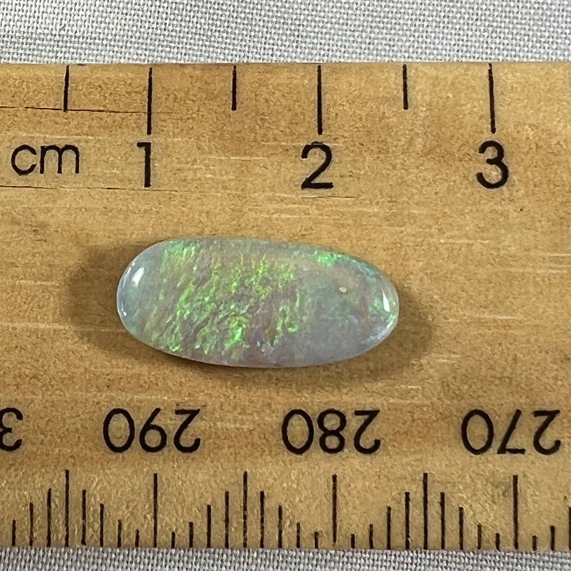 Lightning Ridge grey/green solid opal. Slight sand spot, should rub out, hence the discounted price.