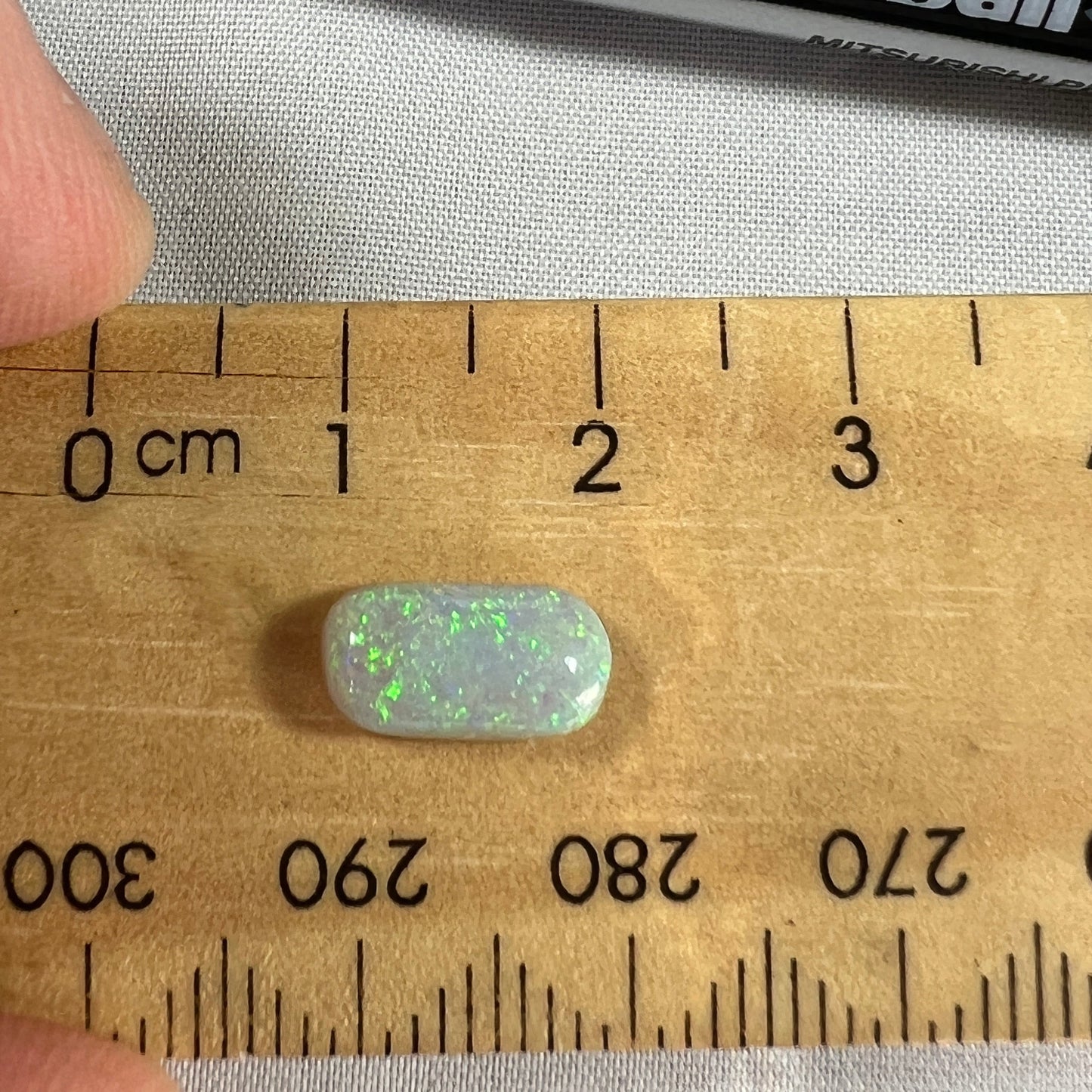 Lightning Ridge grey/green solid opal ready for setting.