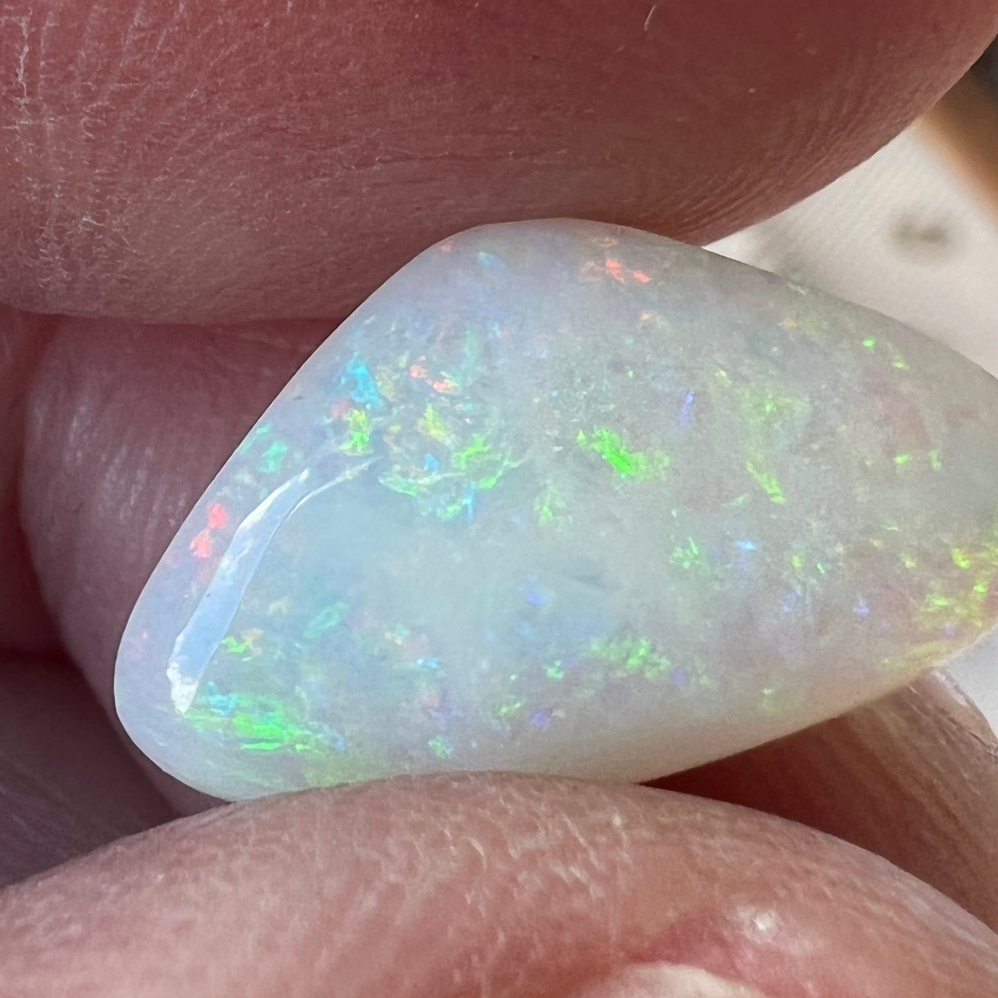 Nice piece of Coober Pedy white opal. Lots of colours showing and a great polish.