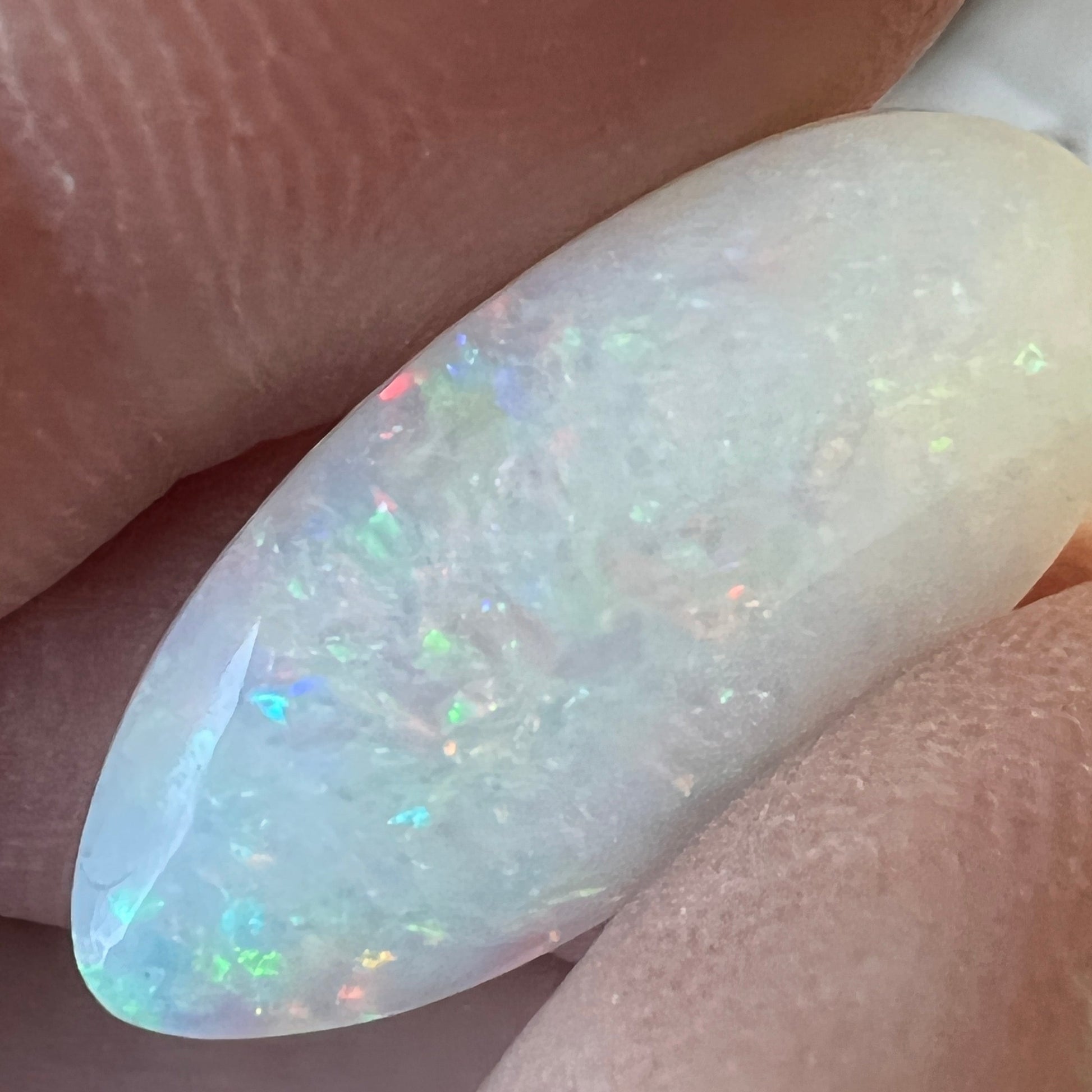 Beautiful 9.1ct Coober Pedy solid white opal. Double sided and showing all the colours. Cut and polished by Bill Johnson.