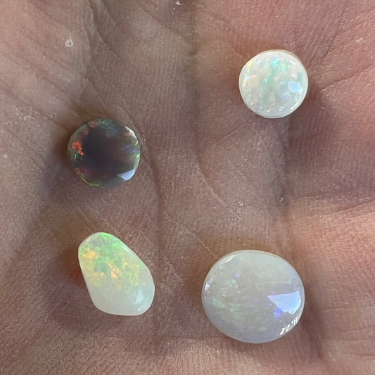 Small mixed group of four lovely solid opals that will make great ring stones. Cut and polished by Bill Johnson.