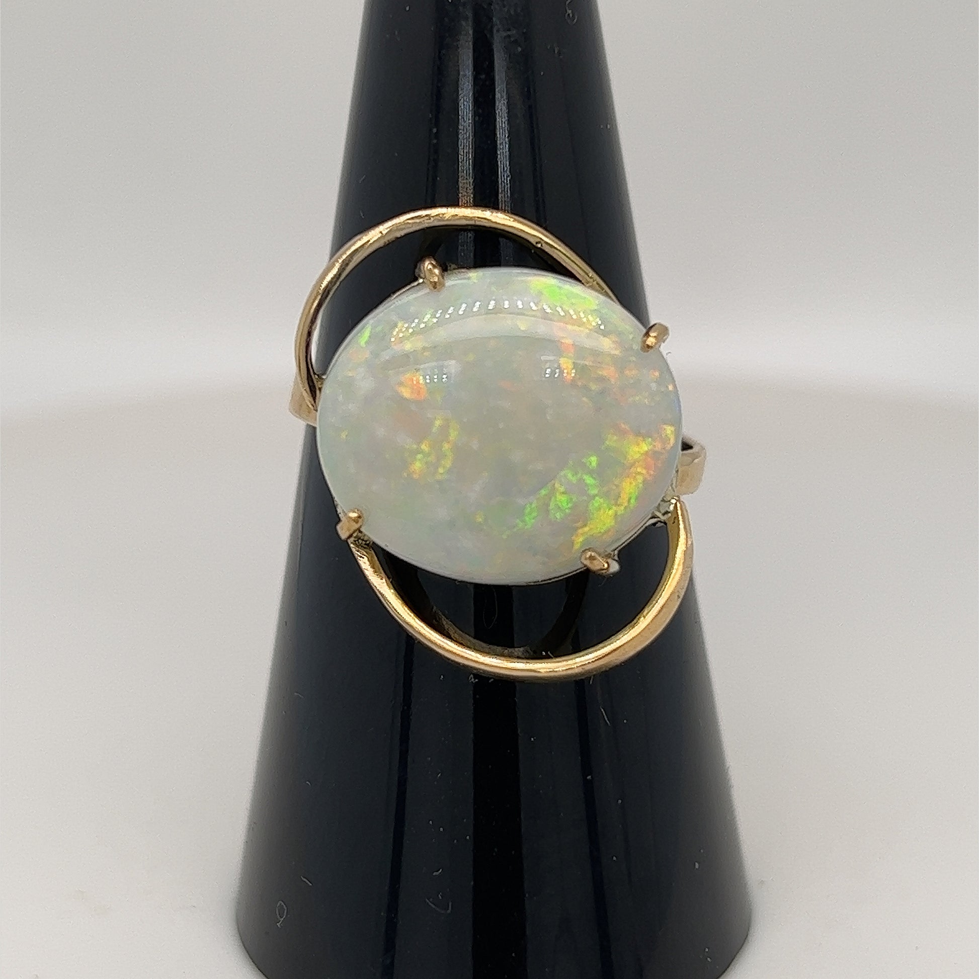Beautiful one-off ring. Wonderful colours in this 4.8ct solid Coober Pedy opal. Set in 14ct gold.