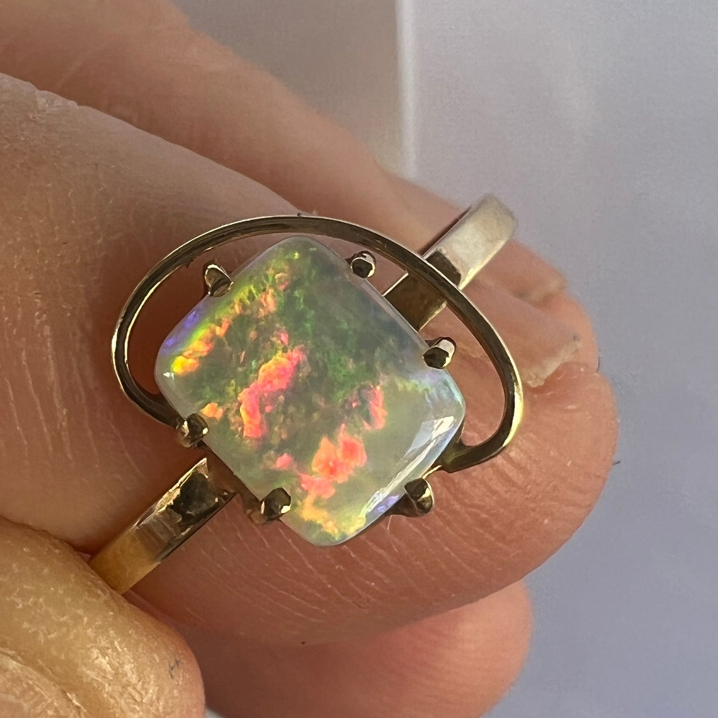 Great little one-off 14ct gold ring featuring a cushion cut Coober Pedy crystal opal. Displays breathtaking colours.