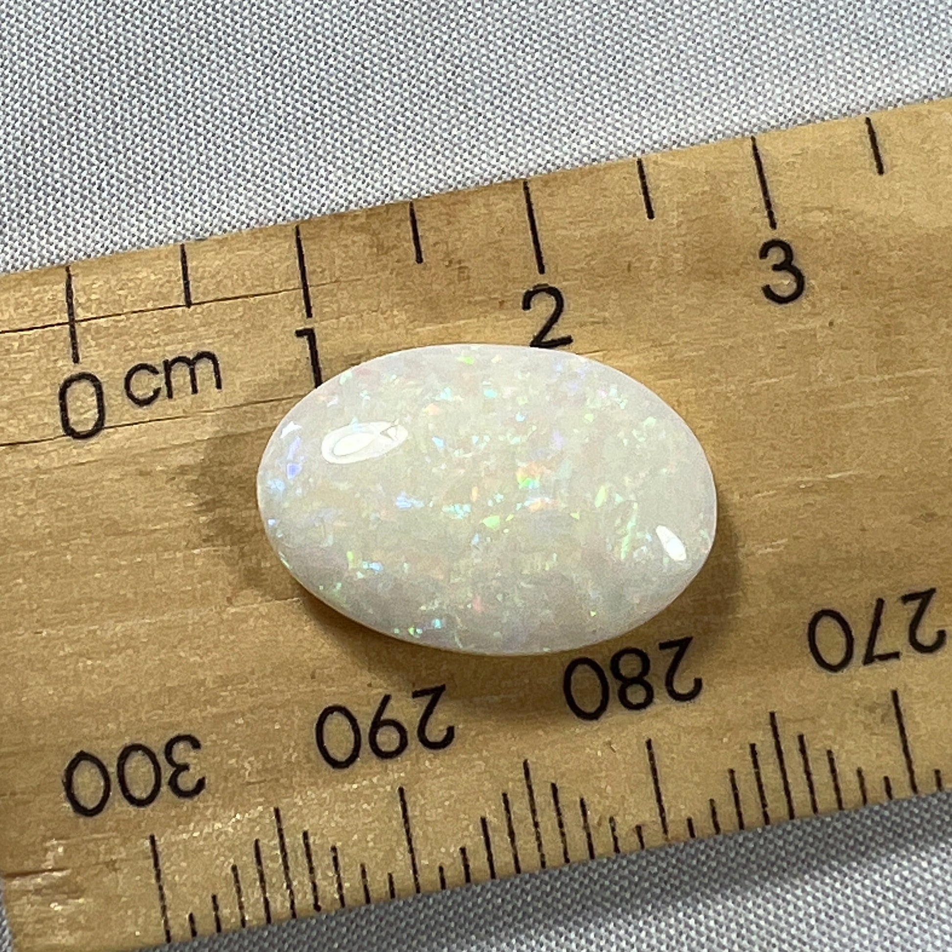 Double sided Coober Pedy solid white opal. beautifully displaying all colours in a pin fire pattern. Ready to go.